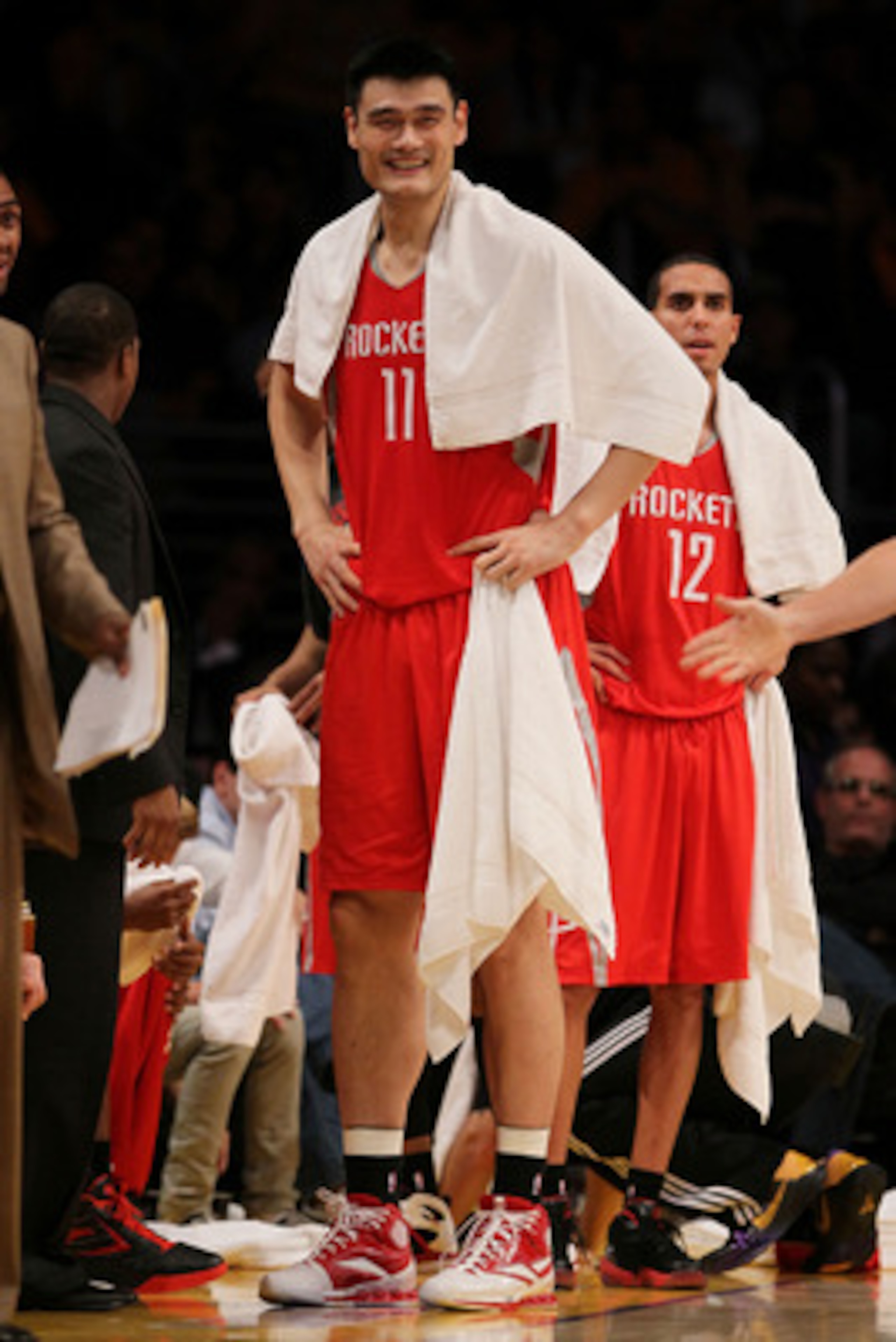LOS ANGELES, CA - OCTOBER 26:  Yao Ming #11 of the Houston Rockets stands by the bench during their opening night game against the Los Angeles Lakers at Staples Center on October 26, 2010 in Los Angeles, California. NOTE TO USER: User expressly acknowledg