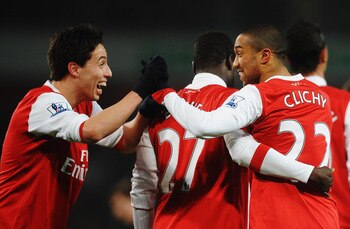 LONDON, UNITED KINGDOM - MARCH 02:  Gael Clichy (R) of Arsenal celebrates with team mate Samir Nasri (L) after scoring his sides fifth goal during the FA Cup sponsored by E.ON 5th Round Replay match between between Arsenal and Leyton Orient at the Emirate