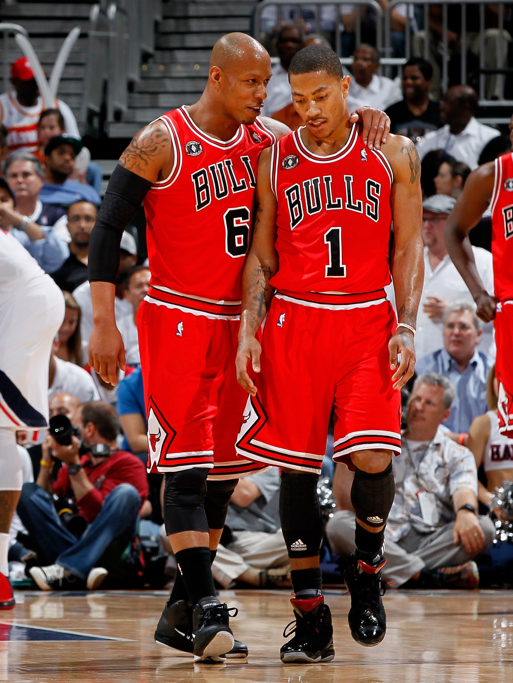 ATLANTA, GA - MAY 06:  Keith Bogans #6 converses with Derrick Rose #1 of the Chicago Bulls after Rose drew a foul from the Atlanta Hawks in Game Three of the Eastern Conference Semifinals in the 2011 NBA Playoffs at Phillips Arena on May 6, 2011 in Atlant