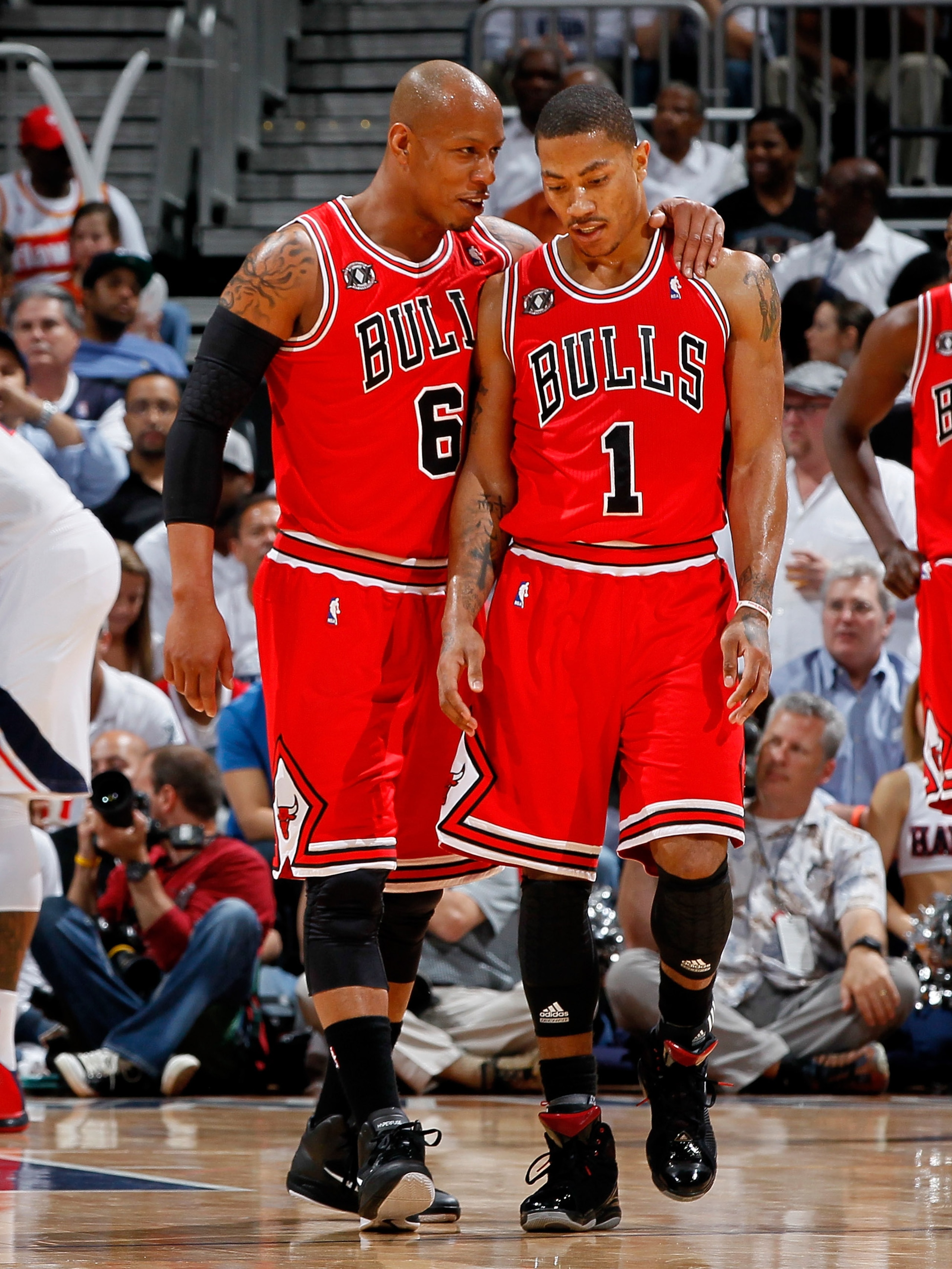 ATLANTA, GA - MAY 06:  Keith Bogans #6 converses with Derrick Rose #1 of the Chicago Bulls after Rose drew a foul from the Atlanta Hawks in Game Three of the Eastern Conference Semifinals in the 2011 NBA Playoffs at Phillips Arena on May 6, 2011 in Atlant