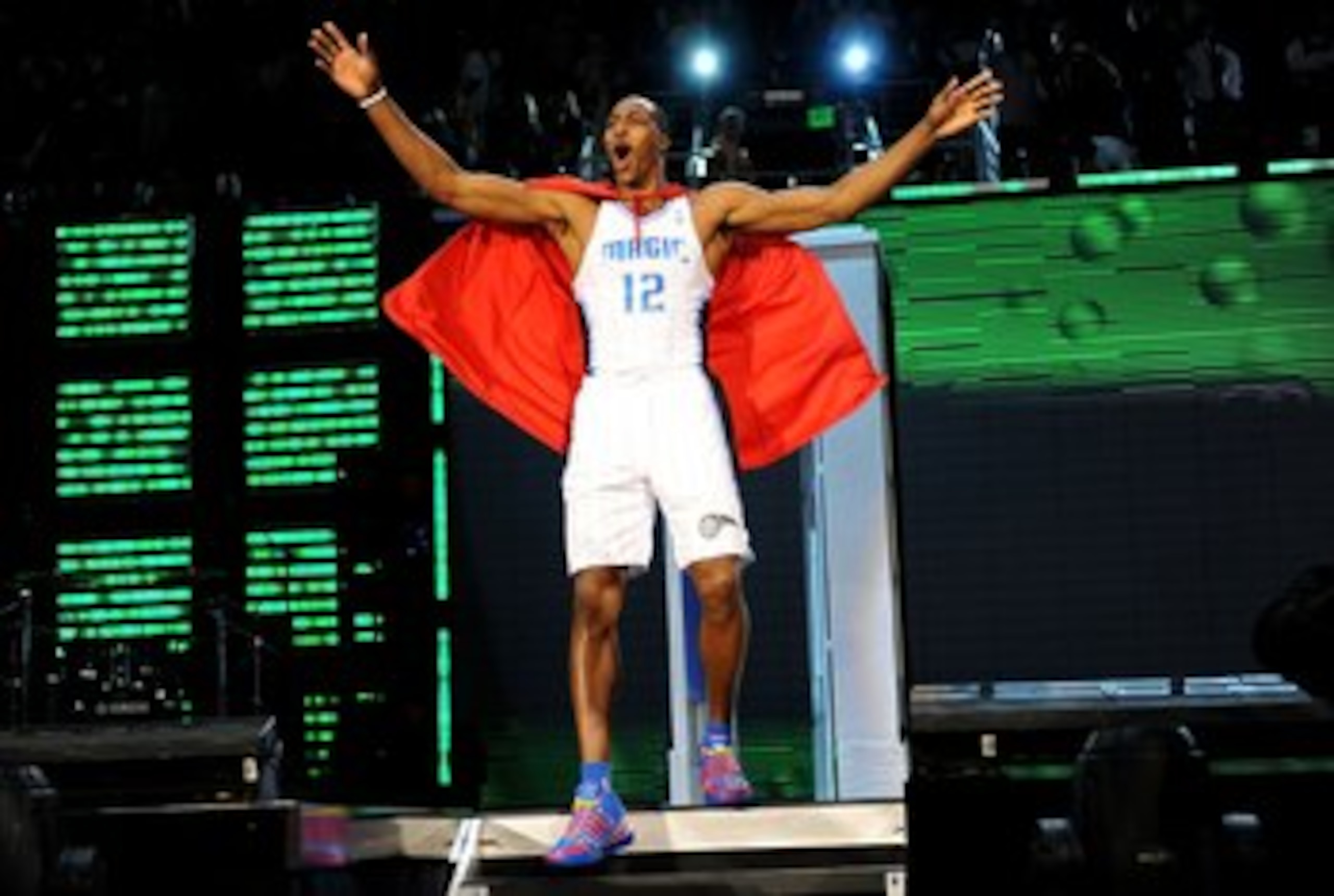 PHOENIX - FEBRUARY 14:  Dwight Howard of the Orlando Magic emerges from a phone booth wearing a Superman cape during the Sprite Slam Dunk Contest on All-Star Saturday Night, part of 2009 NBA All-Star Weekend at US Airways Center on February 14, 2009 in Ph
