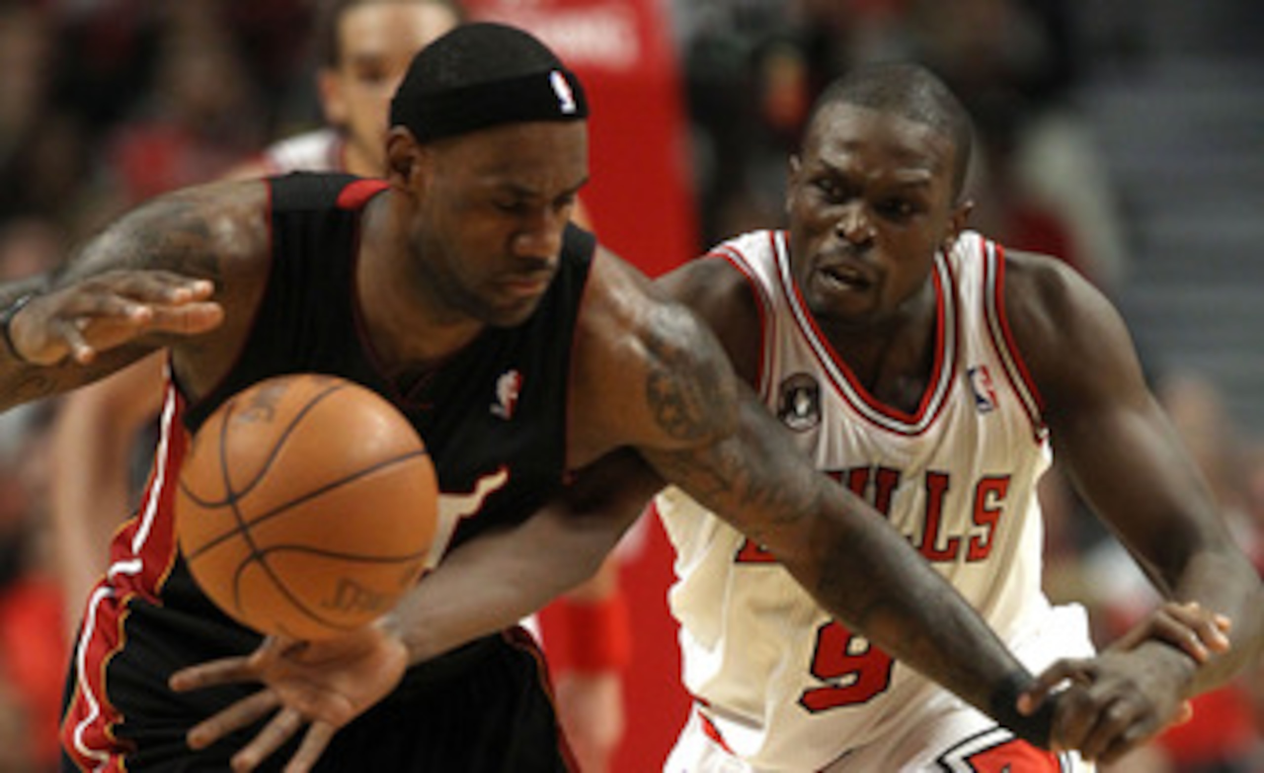 CHICAGO, IL - MAY 15:  Luol Deng #9 of the Chicago Bulls attempts to steal the ball from LeBron James #6 of the Miami Heat in Game One of the Eastern Conference Finals during the 2011 NBA Playoffs on May 15, 2011 at the United Center in Chicago, Illinois.