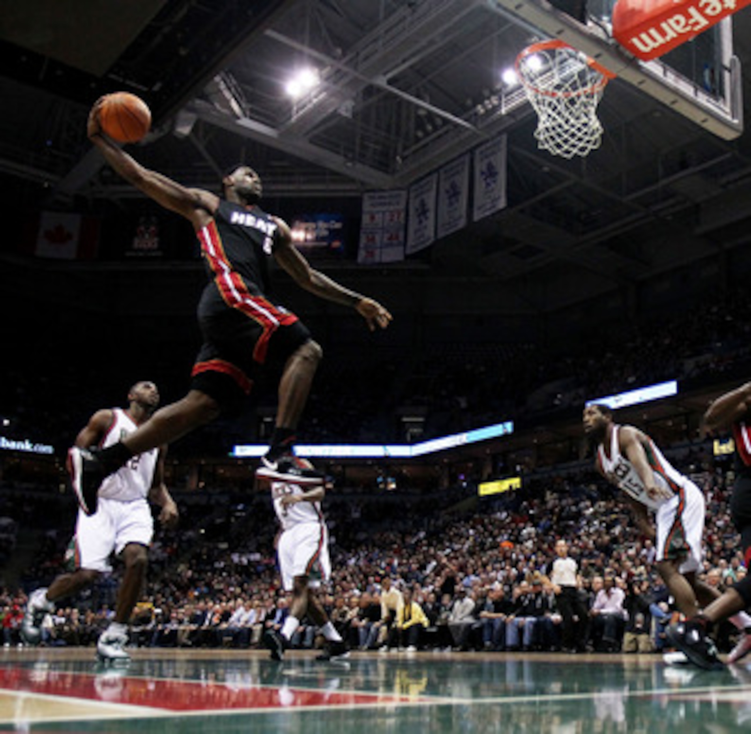 MILWAUKEE, WI - DECEMBER 06: LeBron James #6 of the Miami Heat goes up for a dunk against the Milwaukee Bucks at the Bradley Center on December 6, 2010 in Milwaukee, Wisconsin. NOTE TO USER: User expressly acknowledges and agrees that, by downloading and/