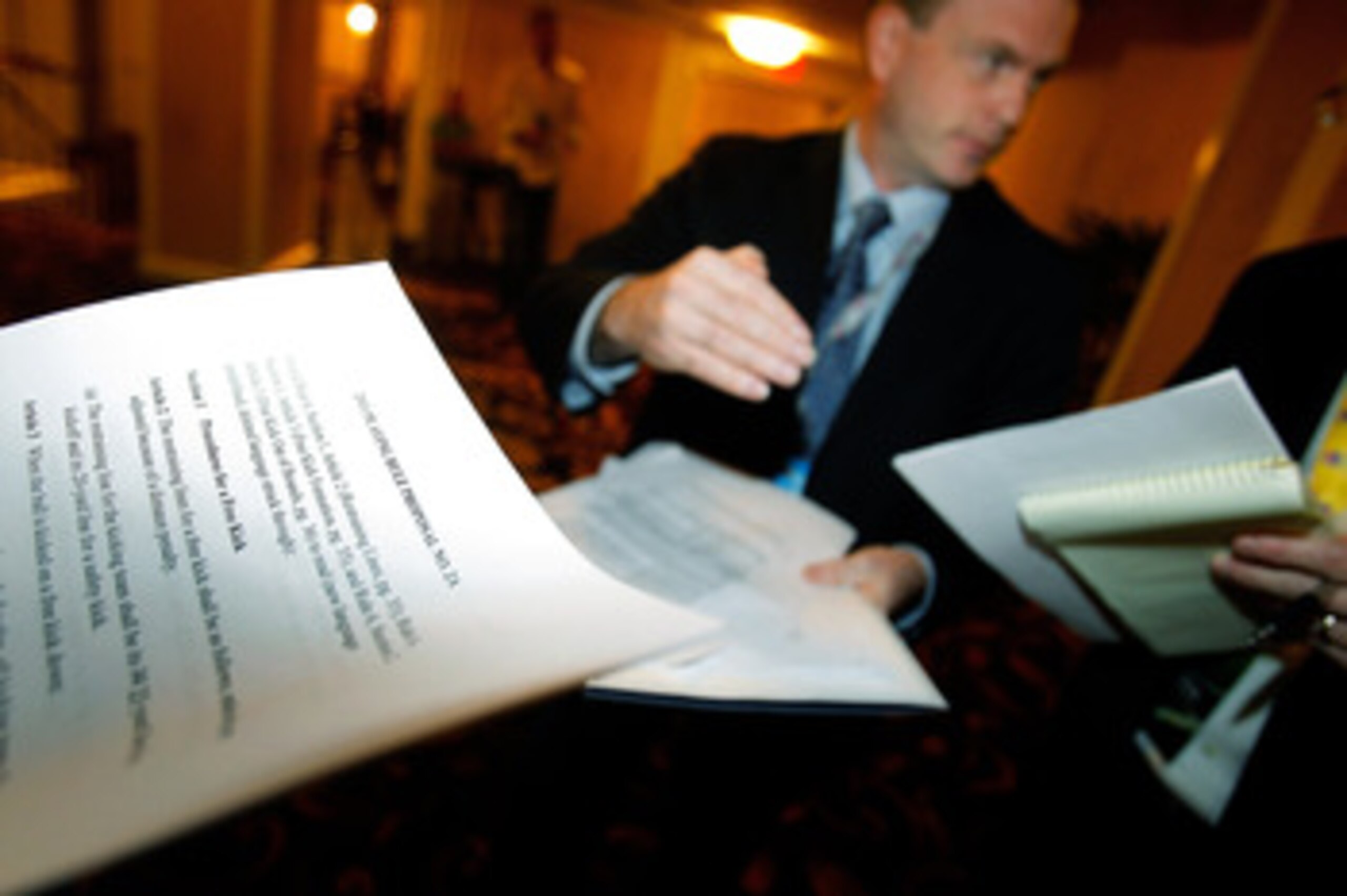 NEW ORLEANS, LA - MARCH 22: NFL Spokesman Brian McCarthy hands out forms explaining rule changes fot the upcoming season to the media during the NFL Annual Meetings at the Roosevelt Hotel on March 22, 2011 in New Orleans, Louisiana. Despite a NFL owners i