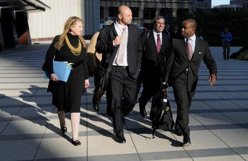 MINNEAPOLIS, MN - MAY 16: NFL players lawyer Barbara P. Berens (L), linebacker Ben Leber of the Minnesota Vikings, NFL players lawyer James Quinn and former NFL Players Association Executive Director DeMaurice Smith leave court-ordered mediation at the U.