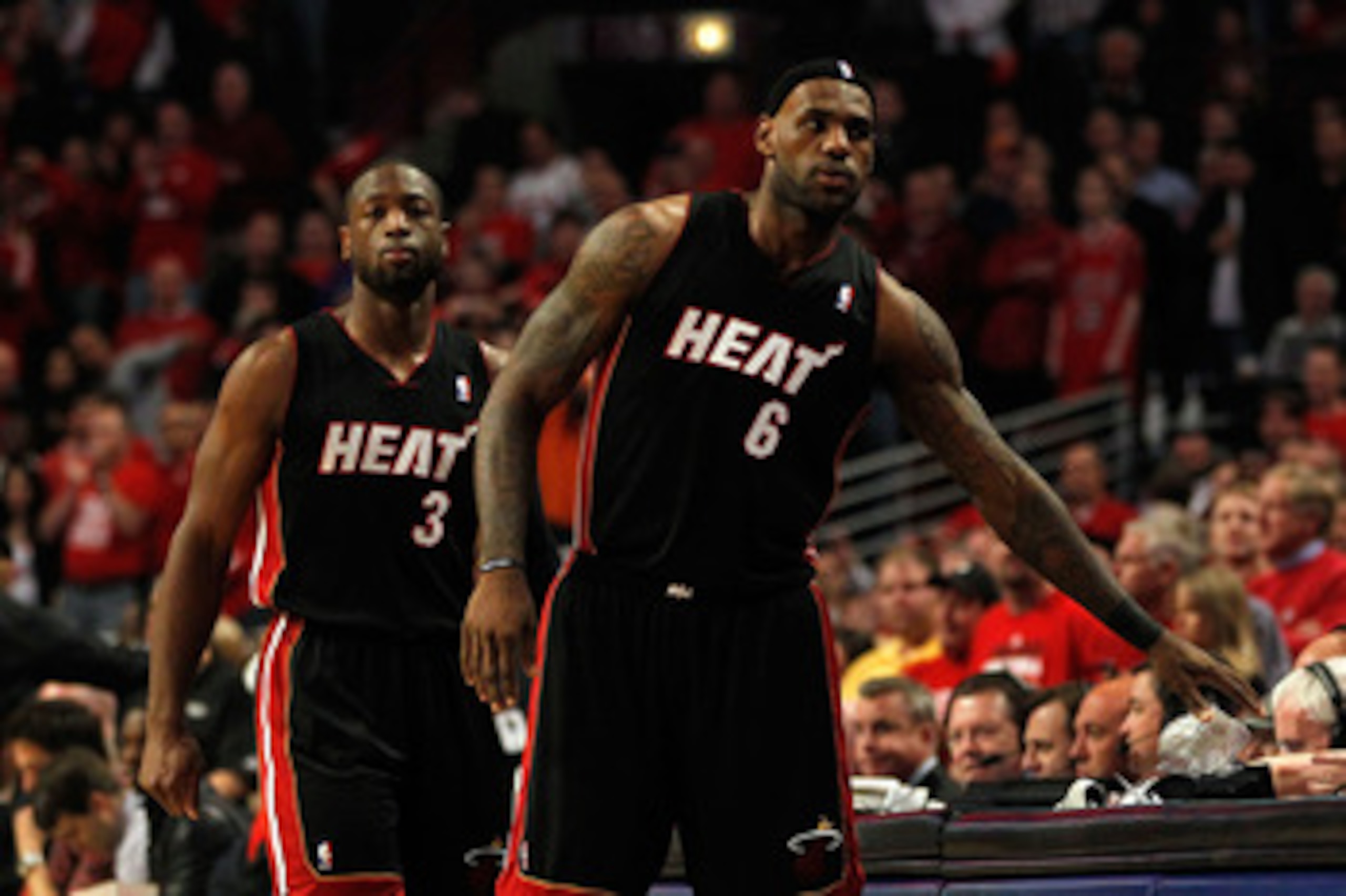 CHICAGO, IL - MAY 15:  (L-R) Dwyane Wade #3 and LeBron James #6 of the Miami Heat check in at the scorer's table priot to the opening tip-off against the Chicago Bulls in Game One of the Eastern Conference Finals during the 2011 NBA Playoffs on May 15, 20