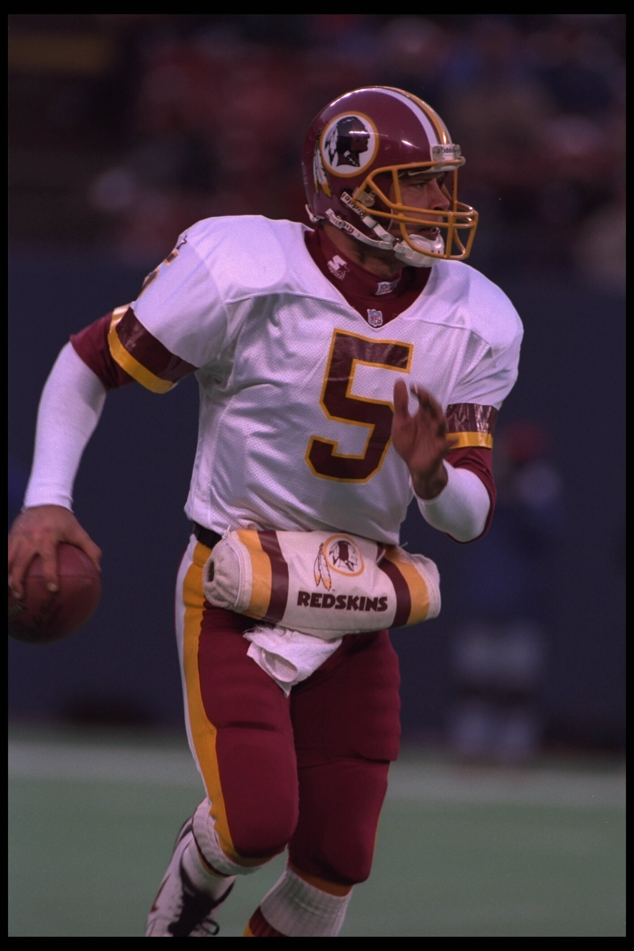 10 Dec 1995:  Quarterback Heath Schuler #5 of the Washington Redskins drops back to pass downfield to a receiver during the game against the New York Giants at Giants Stadium in East Rutherford, New Jersey.  The Giants defeated the Redskins 20-13.  Mandat