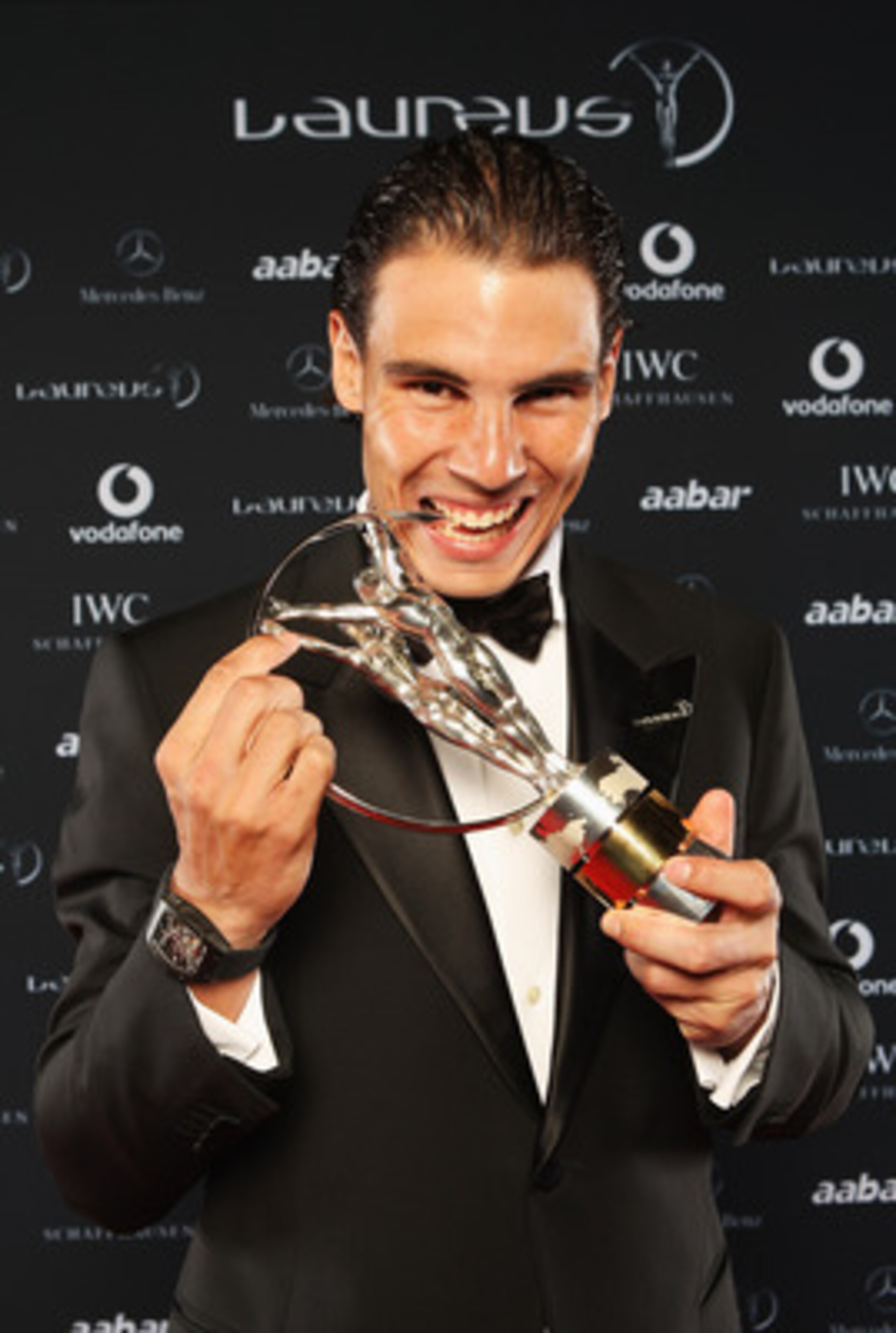 ABU DHABI, UNITED ARAB EMIRATES - FEBRUARY 07:  Tennis Player Rafael Nadal of Spain poses with his award for ÂLaureus World Sportsman of the YearÂ in the winners studio at the 2011 Laureus World Sports Awards at the Emirates Palace on February 7, 2011 in