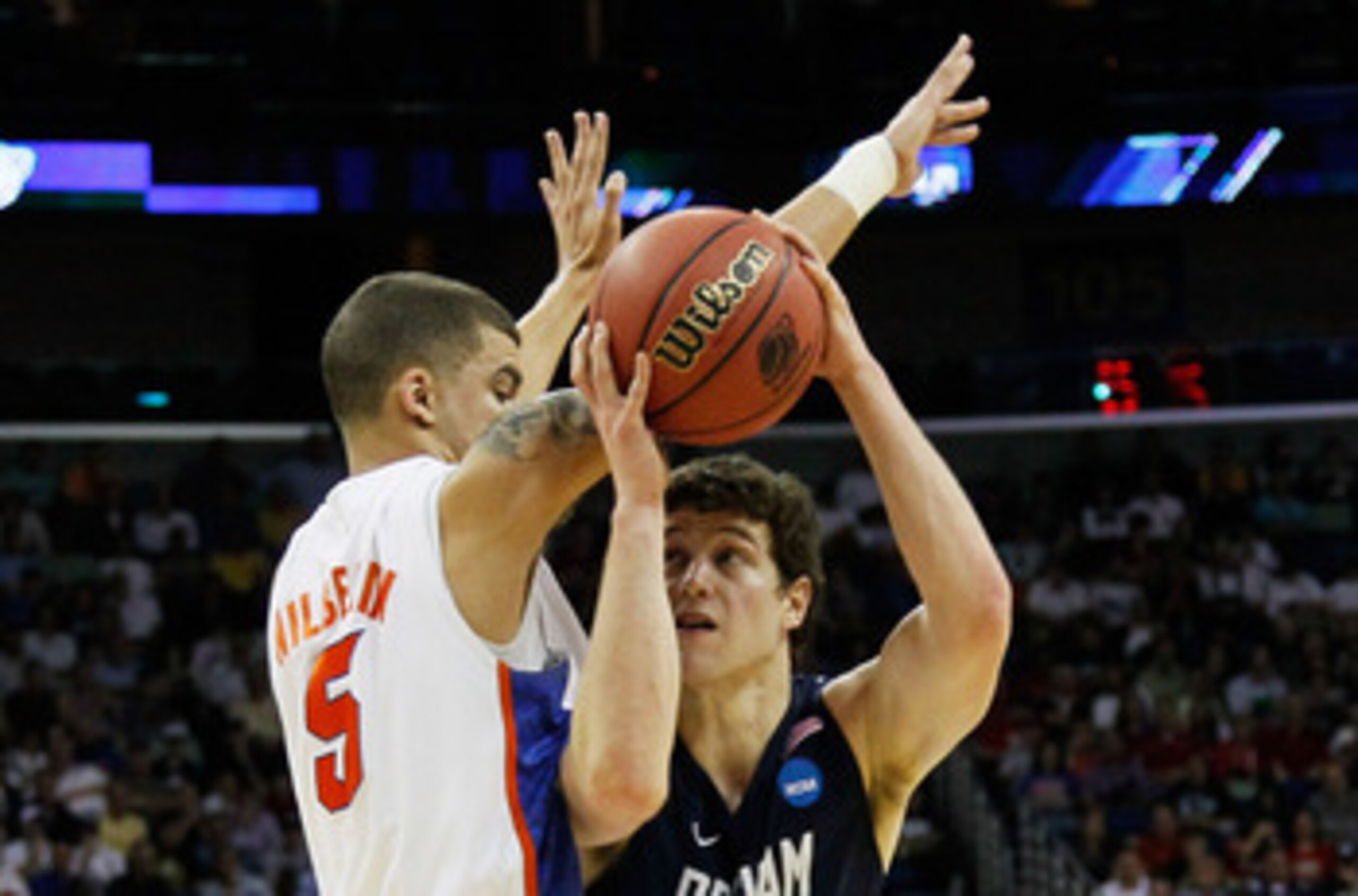 NEW ORLEANS, LA - MARCH 24:  Jimmer Fredette #32 of the Brigham Young Cougars goes up against Scottie Wilbekin #5 of the Florida Gators during the Southeast regional of the 2011 NCAA men's basketball tournament at New Orleans Arena on March 24, 2011 in Ne