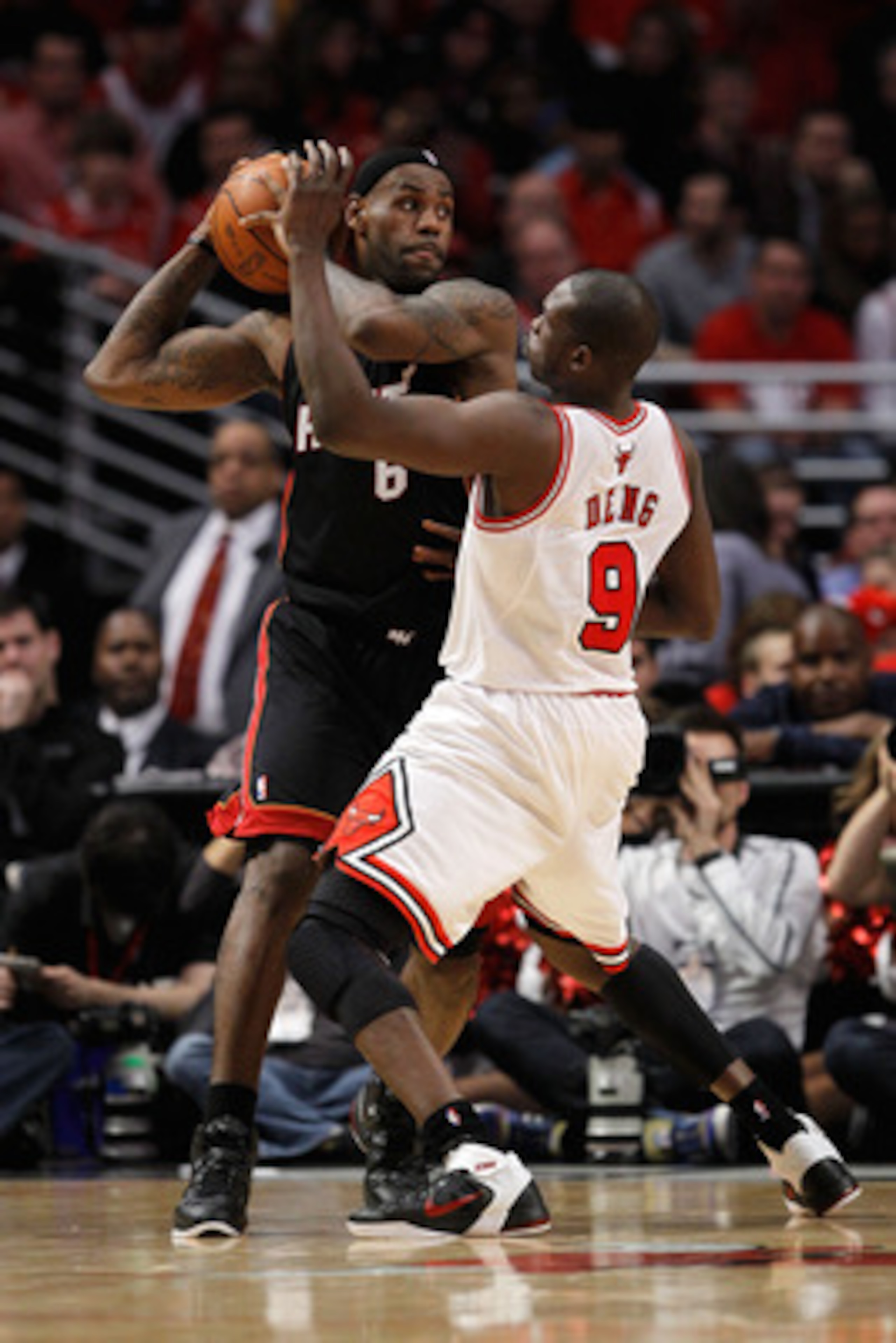 CHICAGO, IL - MAY 15: LeBron James #6 of the Miami Heat looks to pass against the defense of Luol Deng #9 of the Chicago Bulls in Game One of the Eastern Conference Finals during the 2011 NBA Playoffs on May 15, 2011 at the United Center in Chicago, Illin
