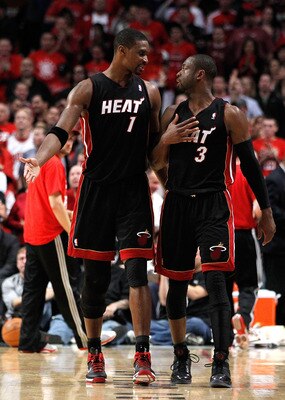 CHICAGO, IL - MAY 15: (L-R) Chris Bosh #1 and Dwyane Wade #3 of the Miami Heat talk on court against the Miami Heat in Game One of the Eastern Conference Finals during the 2011 NBA Playoffs on May 15, 2011 at the United Center in Chicago, Illinois. NOTE T