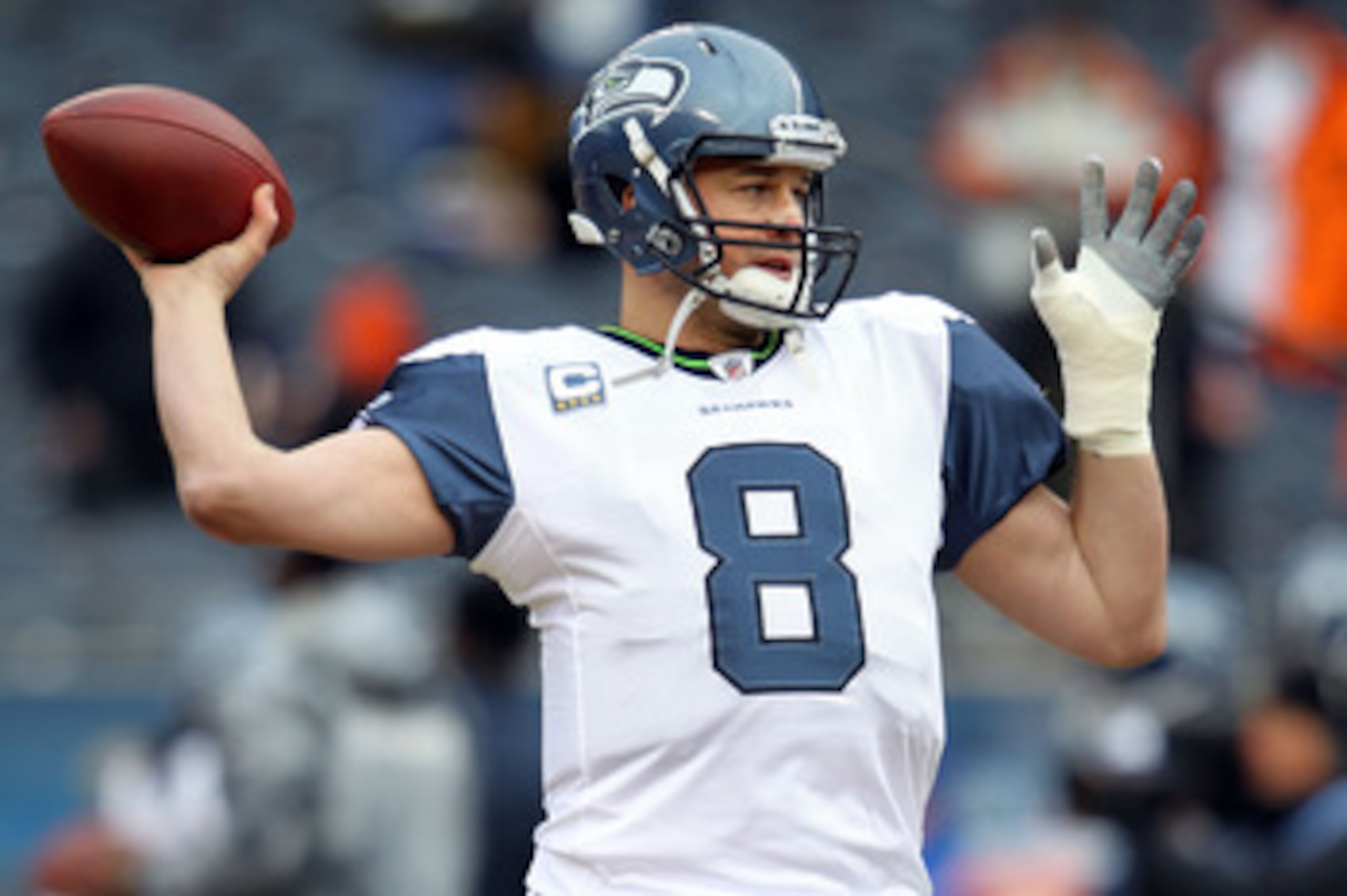 CHICAGO, IL - JANUARY 16:  Quarterback Matt Hasselbeck #8 of the Seattle Seahawks looks to throw the ball during pregame before taking on the Chicago Bears in the 2011 NFC divisional playoff game at Soldier Field on January 16, 2011 in Chicago, Illinois. 