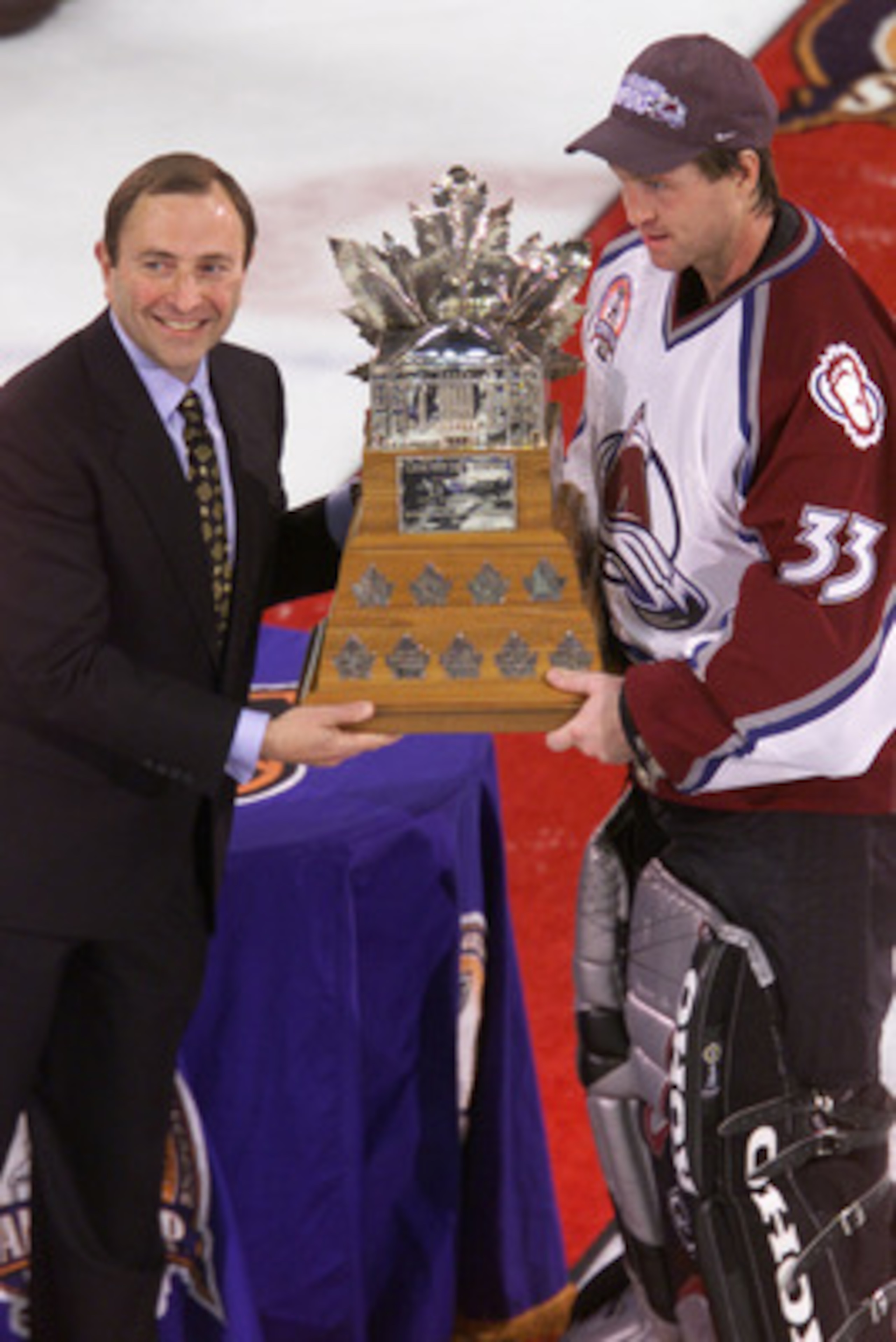 9 Jun 2001: Goalie Patrick Roy #33 of the Colorado Avalanche is presented the Conn Smythe Trophy by NHL commissioner Gary Bettman after defeating the New Jersey Devils during the Stanley Cup finals at the Pepsi Center in Denver, Colorado. The Avalanche de