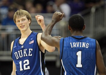 KANSAS CITY, MO - NOVEMBER 23:  Kyle Singler #12 of the Duke Blue Devils is congratulated by Kyrie Irving #1 after scoring during the CBE Classic championship game on November 23, 2010 at the Sprint Center in Kansas City, Missouri.  (Photo by Jamie Squire