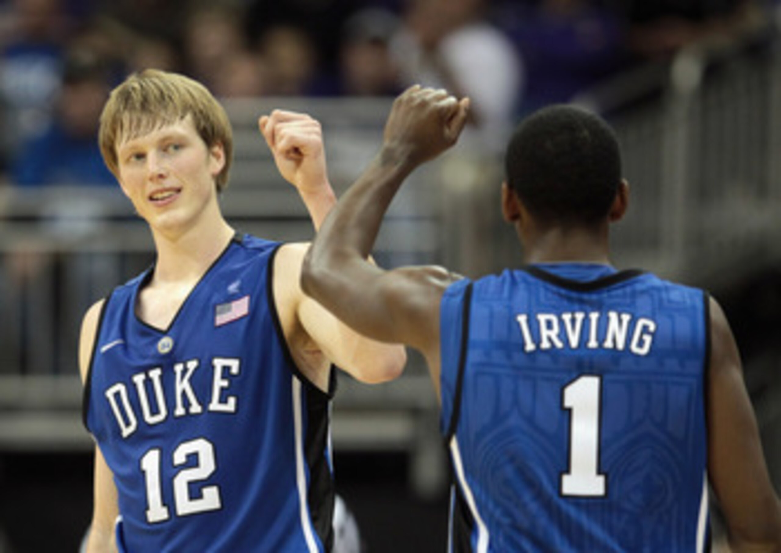 KANSAS CITY, MO - NOVEMBER 23:  Kyle Singler #12 of the Duke Blue Devils is congratulated by Kyrie Irving #1 after scoring during the CBE Classic championship game on November 23, 2010 at the Sprint Center in Kansas City, Missouri.  (Photo by Jamie Squire