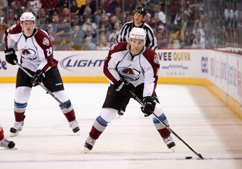 GLENDALE, AZ - APRIL 01:  John-Michael Liles #4 of the Colorado Avalanche skates with the puck during the NHL game against the Phoenix Coyotes at Jobing.com Arena on April 1, 2011 in Glendale, Arizona.  The Avalanche defeated the Coyotes 4-3 in an overtim