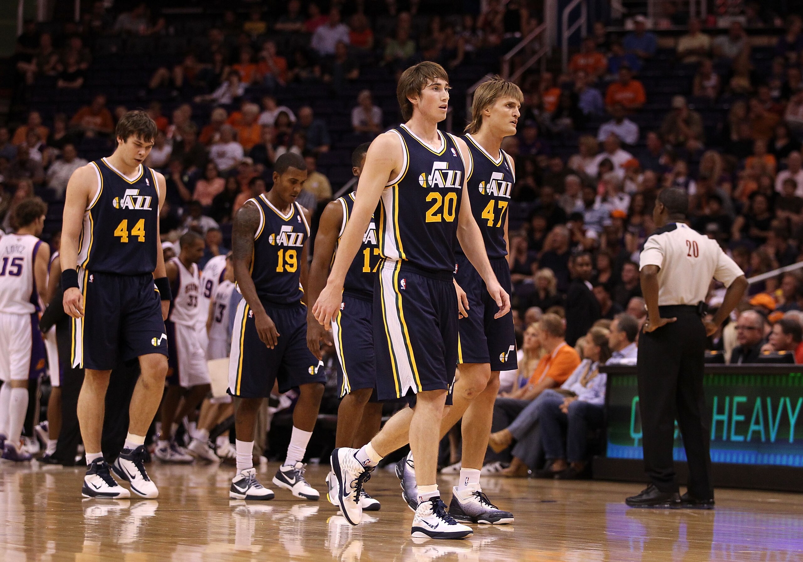 PHOENIX - OCTOBER 12:  Gordon Hayward #20 of the Utah Jazz walks back to the bench with teammates during the preseason NBA game against the Phoenix Suns at US Airways Center on October 12, 2010 in Phoenix, Arizona. NOTE TO USER: User expressly acknowledge