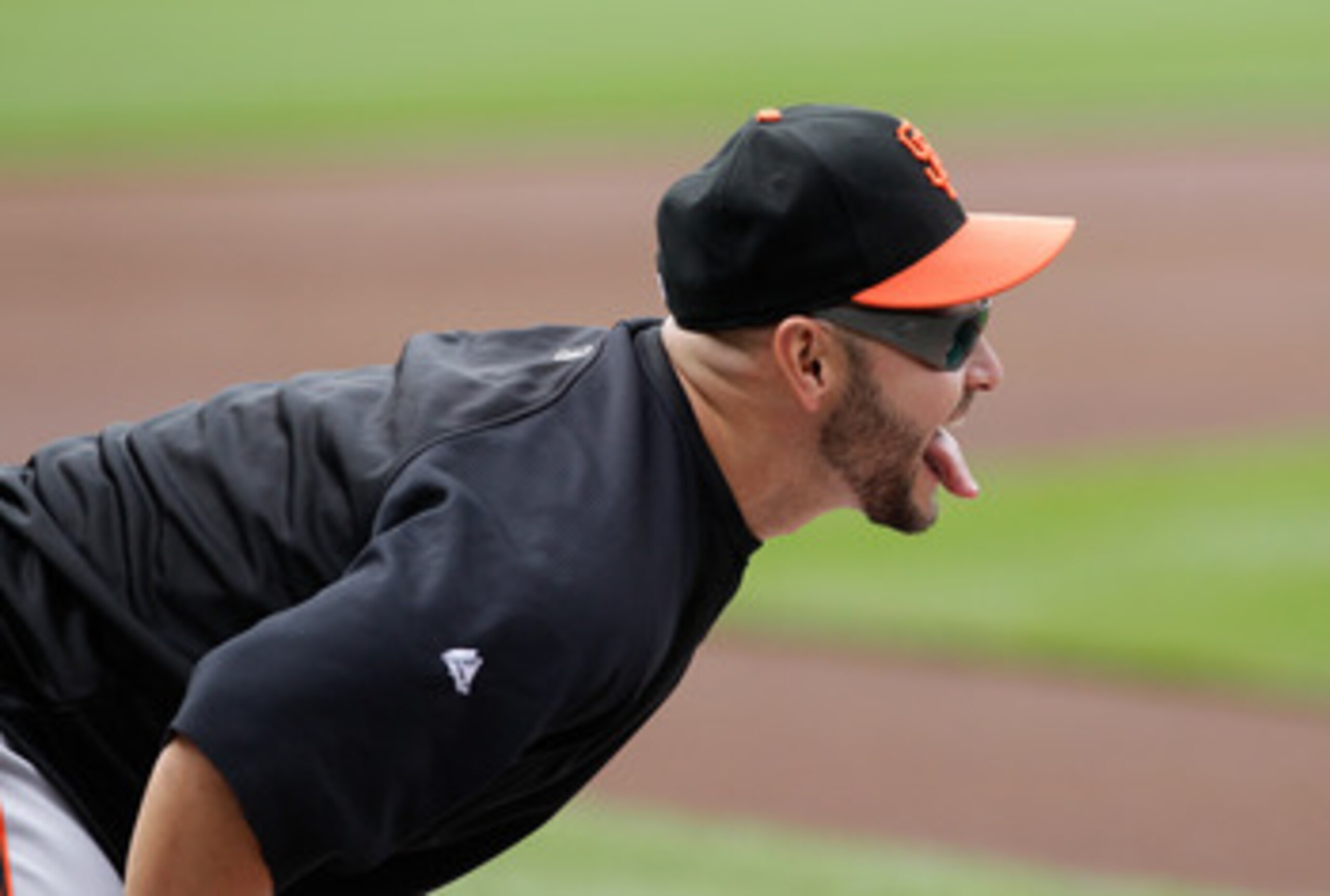 WASHINGTON, DC - APRIL 29: Cody Ross #13 of the San Francisco Giants laughs while stretching before the start of their game against the Washington Nationals at Nationals Park on April 29, 2011 in Washington, DC.  (Photo by Rob Carr/Getty Images)