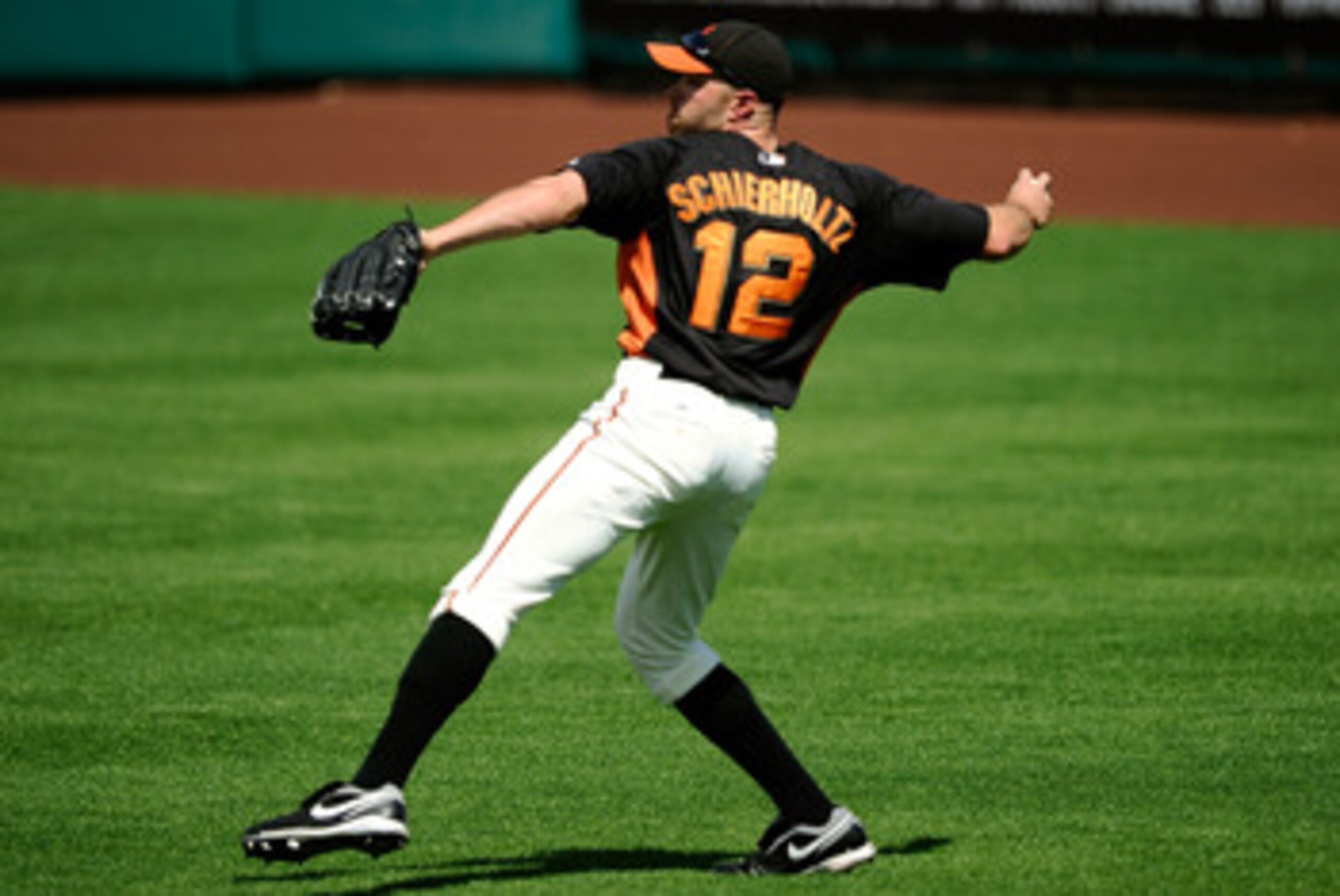 SCOTTSDALE, AZ - MARCH 18:  Nate Schierholtz #12 of the San Francisco Giants plays against during the spring training baseball game against the Los Angeles Dodgers at Scottsdale Stadium on March 18, 2011 in Scottsdale, Arizona.  (Photo by Kevork Djansezia