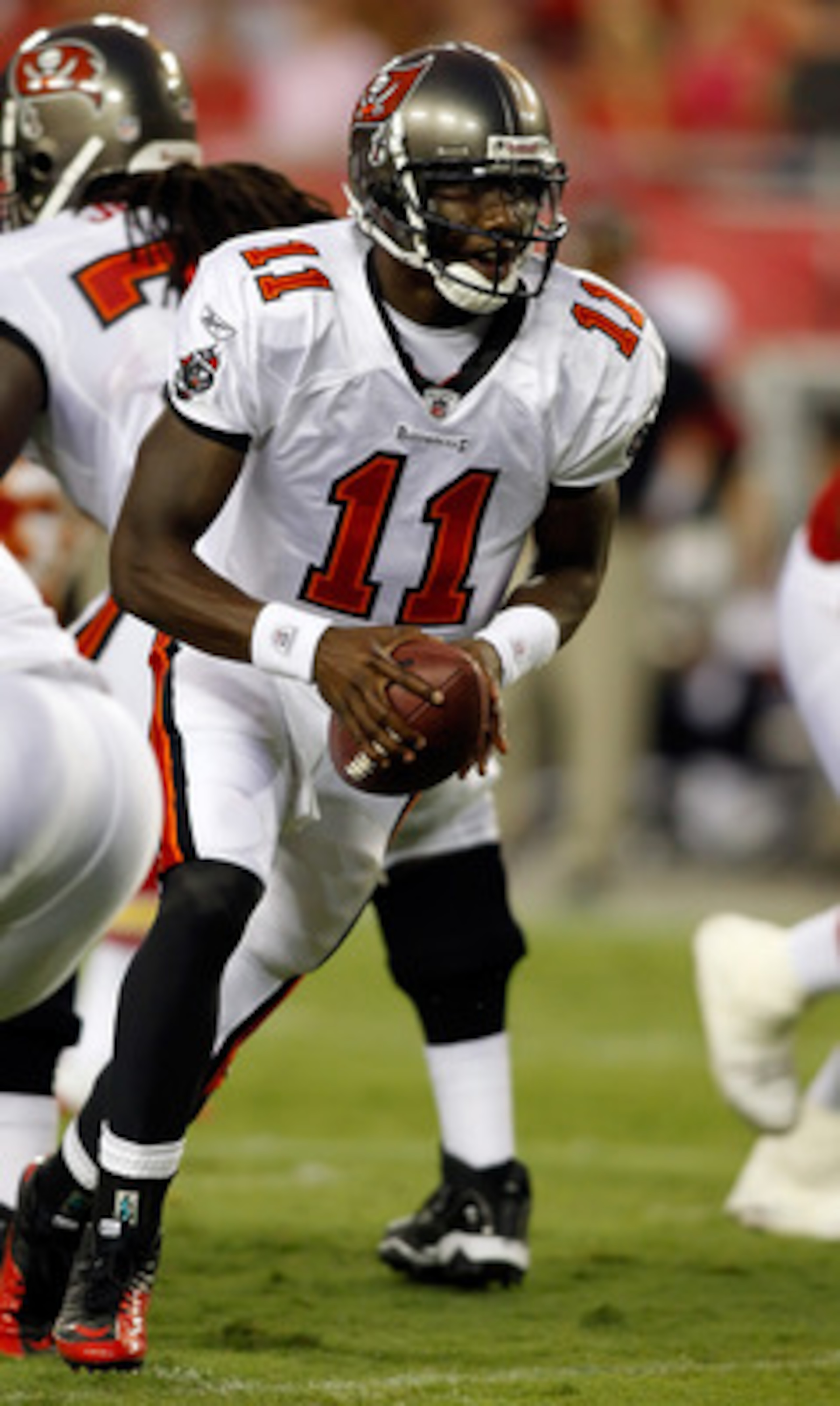TAMPA, FL - AUGUST 21:  Quarterback Josh Johnson #11 of the Tampa Bay Buccaneers looks to hand the ball off against the Kansas City Chiefs during a preseason game at Raymond James Stadium on August 21, 2010 in Tampa, Florida.  (Photo by J. Meric/Getty Ima