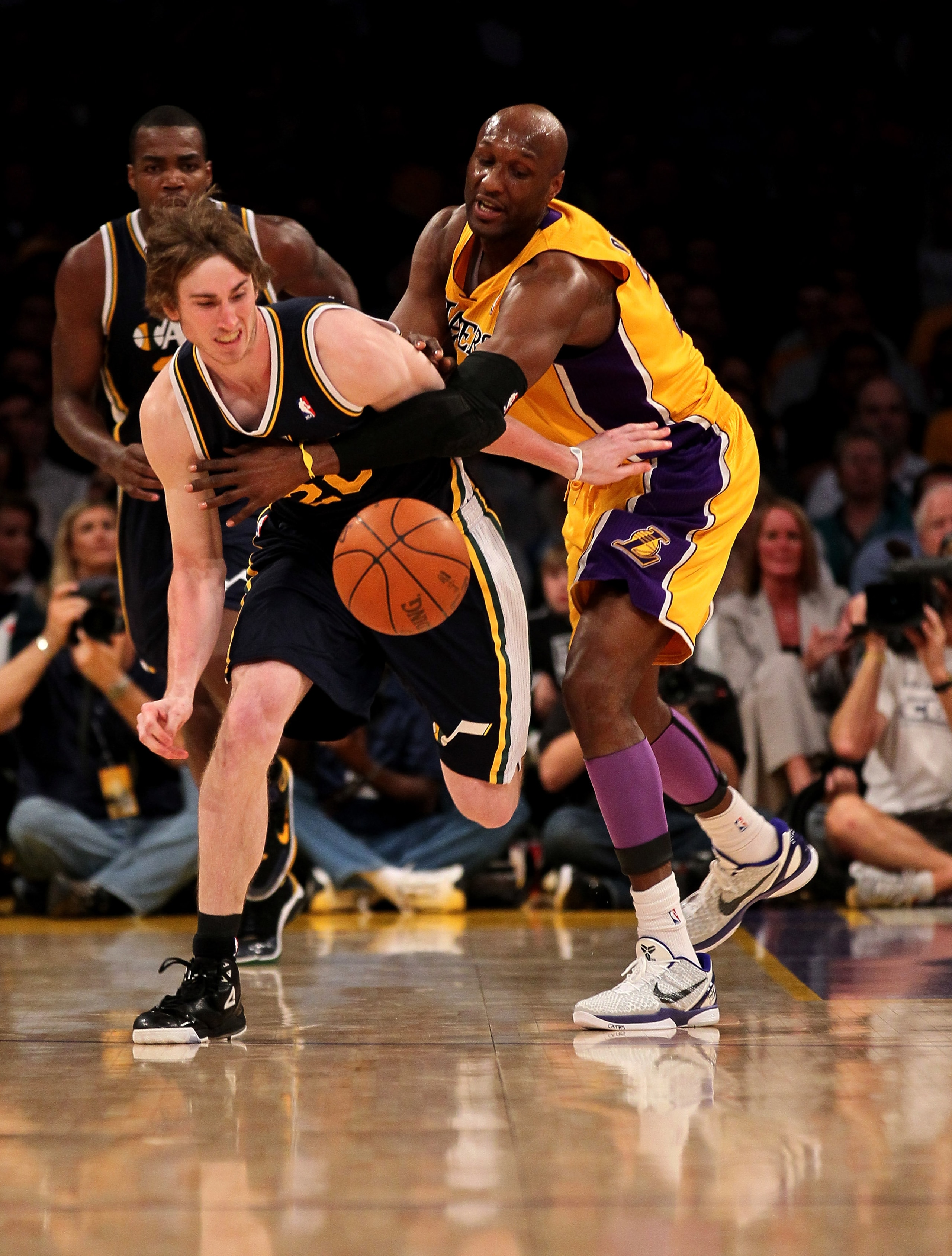 LOS ANGELES, CA - APRIL 5:  Gordon Hayward #20 of the Utah Jazz and Lamar Odom #7 of the Los Angeles Lakers fight for a loose ball at Staples Center on April 5, 2011 in Los Angeles, California.  NOTE TO USER: User expressly acknowledges and agrees that, b