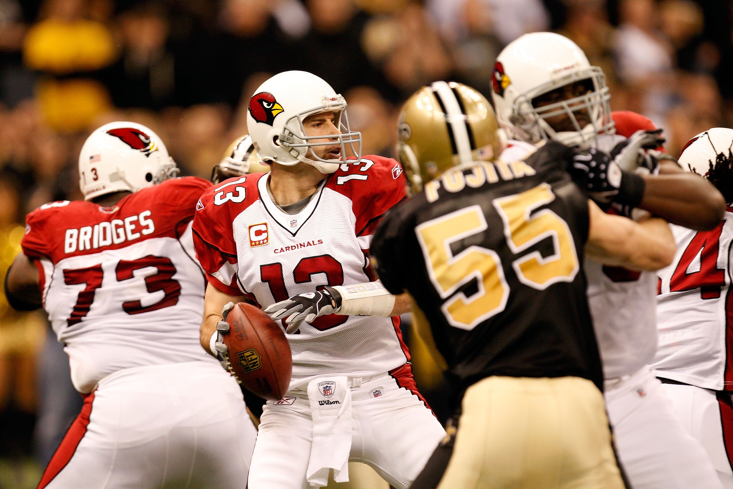 NEW ORLEANS - JANUARY 16:  Kurt Warner #13 of the Arizona Cardinals looks to pass against the New Orleans Saints during the NFC Divisional Playoff Game at Louisana Superdome on January 16, 2010 in New Orleans, Louisiana.  (Photo by Ronald Martinez/Getty I