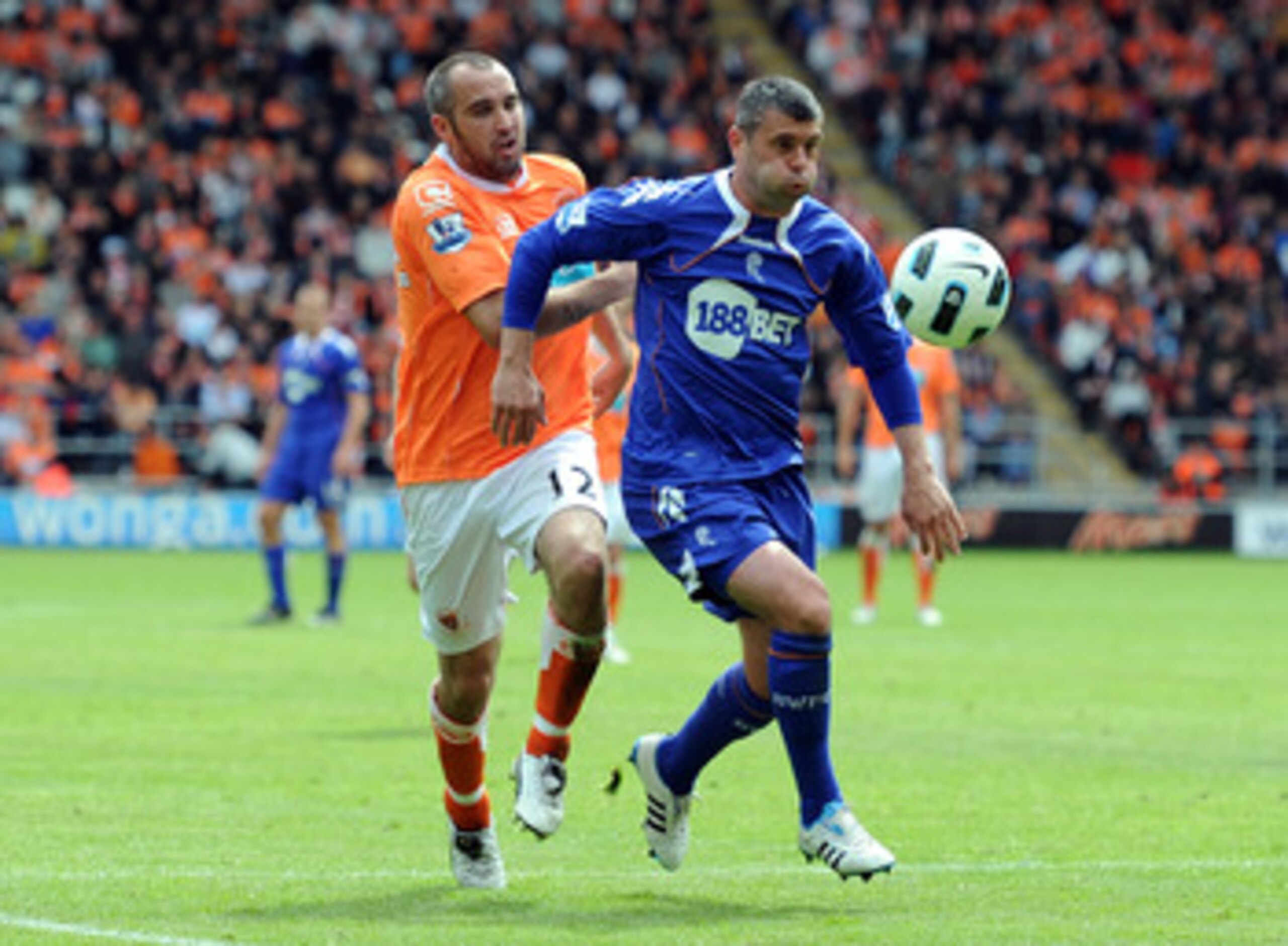 BLACKPOOL, ENGLAND - MAY 14:  Gary Taylor-Fletcher of Blackpool competes wiith Paul Robinson of Bolton Wanderers during the Barclays Premier League match between Blackpool and Bolton Wanderers at Bloomfield Road on May 14, 2011 in Blackpool, England.  (Ph