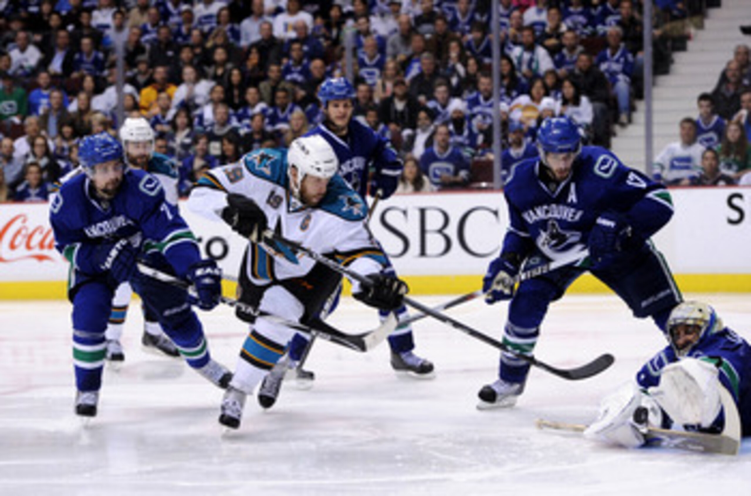 VANCOUVER, CANADA - MAY 15: Goaltender Roberto Luongo #1 of the Vancouver Canucks makes a save on a backhand shot by Joe Thornton #19 of the San Jose Sharks as Ryan Kesler #17 and Dan Hamhuis #2 of the Vancouver Canucks look on in Game One of the Western VANCOUVER, CANADA - MAY 15: Goaltender Roberto Luongo #1 of the Vancouver Canucks makes a save on a backhand shot by Joe Thornton #19 of the San Jose Sharks as Ryan Kesler #17 and Dan Hamhuis #2 of the Vancouver Canucks look on in Game One of the Western