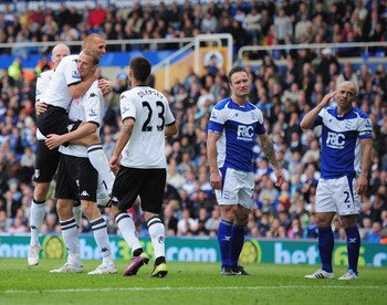BIRMINGHAM, ENGLAND - MAY 15:  Brede Hangeland of Fulham celebrates with team-mates after scoring during the Barclays Premier League match between Birmingham City and Fulham at St. Andrews on May 15, 2011 in Birmingham, England.  (Photo by Shaun Botterill