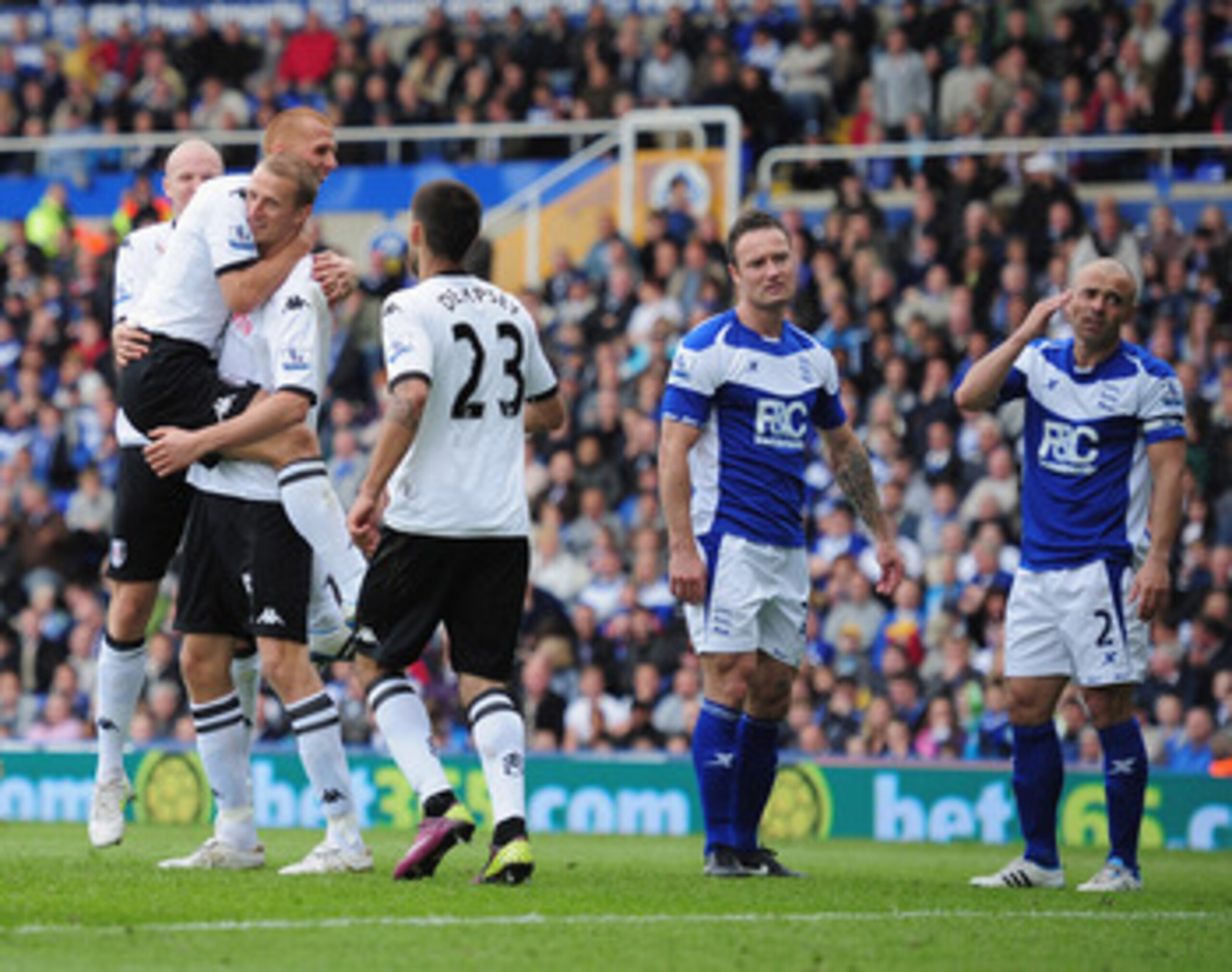 BIRMINGHAM, ENGLAND - MAY 15:  Brede Hangeland of Fulham celebrates with team-mates after scoring during the Barclays Premier League match between Birmingham City and Fulham at St. Andrews on May 15, 2011 in Birmingham, England.  (Photo by Shaun Botterill