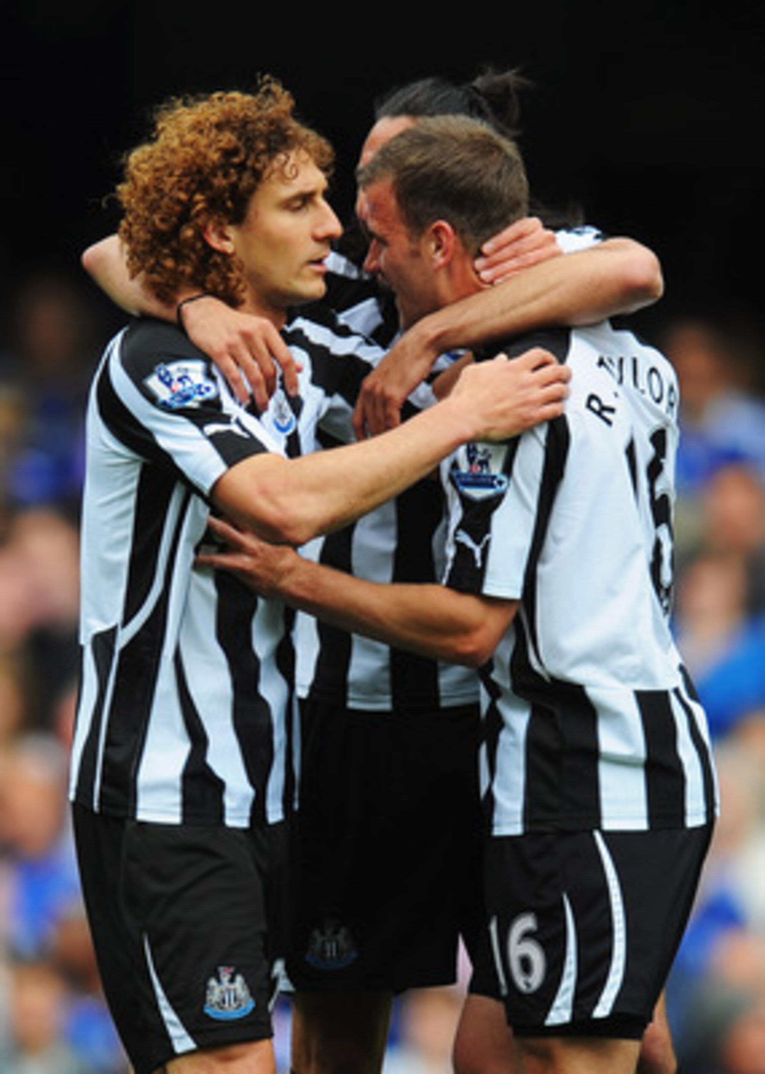 LONDON, ENGLAND - MAY 15: Ryan Taylor (R) is congratulated by Fabricio Coloccini (L) and Jonas Gutierrez (C) as his free kick is deflected into the Chelsea goal during the Barclays Premier League match between Chelsea and Newcastle United at Stamford Brid