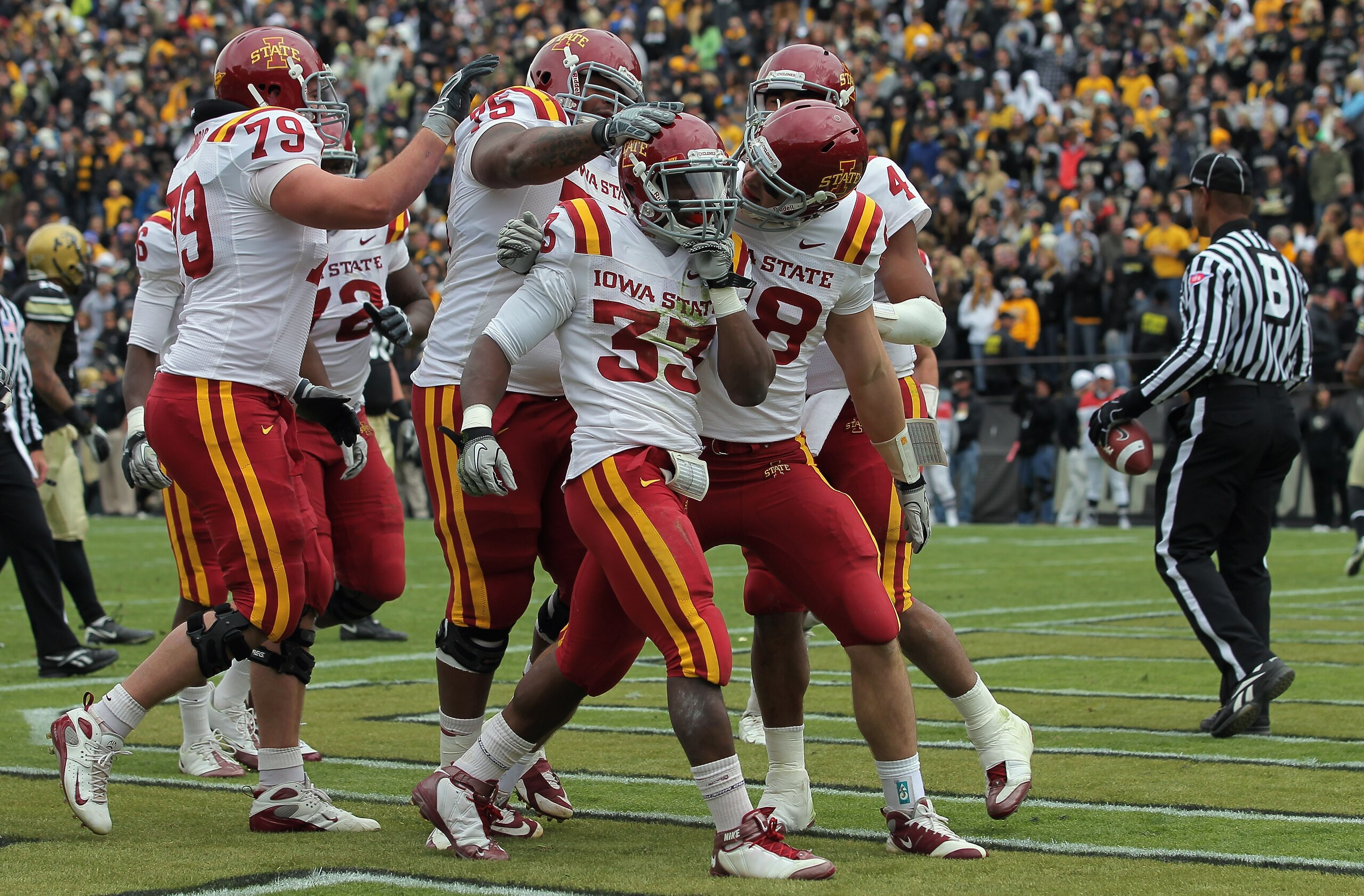 BOULDER, CO - NOVEMBER 13: Alexander Robinson #33 of the Iowa State Cyclones celebrates his eight yard touchdown run in the second quarter with his teammates against the Colorado Buffaloes at Folsom Field on November 13, 2010 in Boulder, Colorado. Colora BOULDER, CO - NOVEMBER 13: Alexander Robinson #33 of the Iowa State Cyclones celebrates his eight yard touchdown run in the second quarter with his teammates against the Colorado Buffaloes at Folsom Field on November 13, 2010 in Boulder, Colorado. Colora