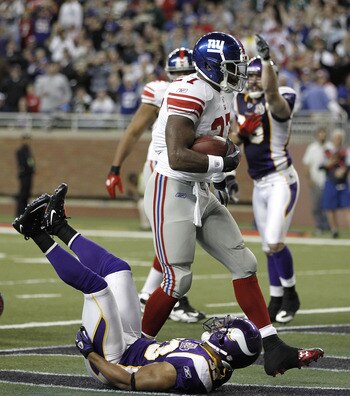 DETROIT, MI - DECEMBER 13:  Brandon Jacobs #27 of the New York Giants scores a second quarter touchdown over Jamarca Sanford #33 of the Minnesota Vikings at Ford Field on December 13, 2010 in Detroit, Michigan.  (Photo by Gregory Shamus/Getty Images)