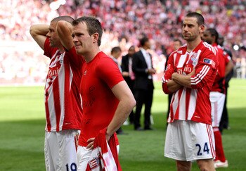 LONDON, ENGLAND - MAY 14:  Jonathan Walters of Stoke City and his team mates look dejected at the end of the FA Cup sponsored by E.ON Final match between Manchester City and Stoke City at Wembley Stadium on May 14, 2011 in London, England.  (Photo by Alex