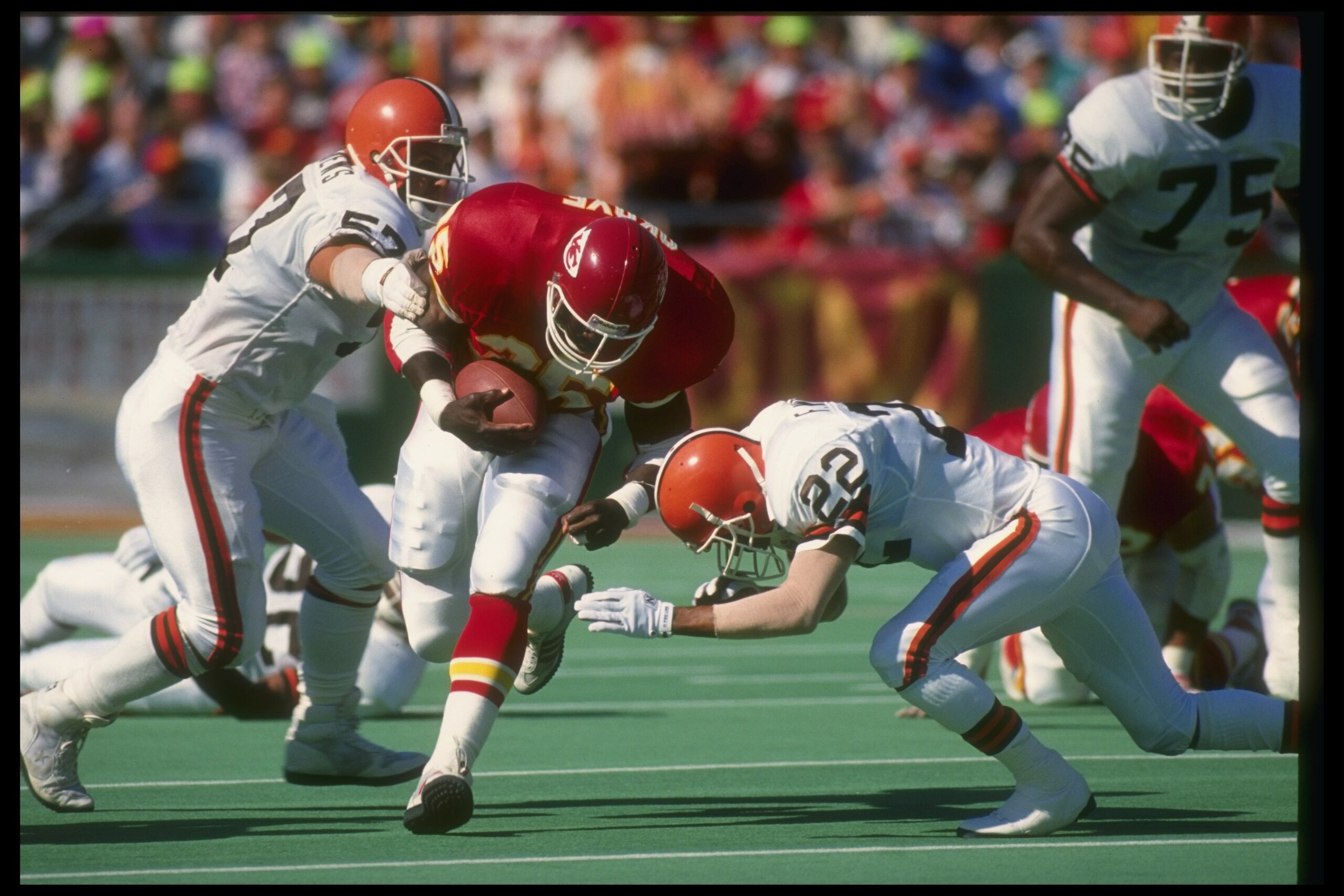 30 Sep 1990: Running back Christian Okoye of the Kansas City Chiefs (center) moves the ball during a game against the Cleveland Browns at Arrowhead Stadium in Kansas City, Missouri. The Chiefs won the game, 34-0.