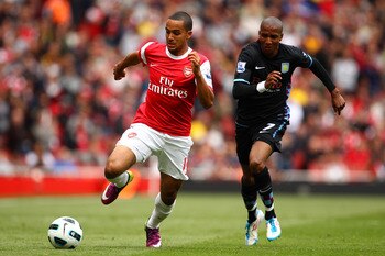 LONDON, ENGLAND - MAY 15:  Theo Walcott (L) of Arsenal in action against Ashley Young of Aston Villa during the Barclays Premier League match between Arsenal and Aston Villa at the Emirates Stadium on May 15, 2011 in London, England.  (Photo by Richard He