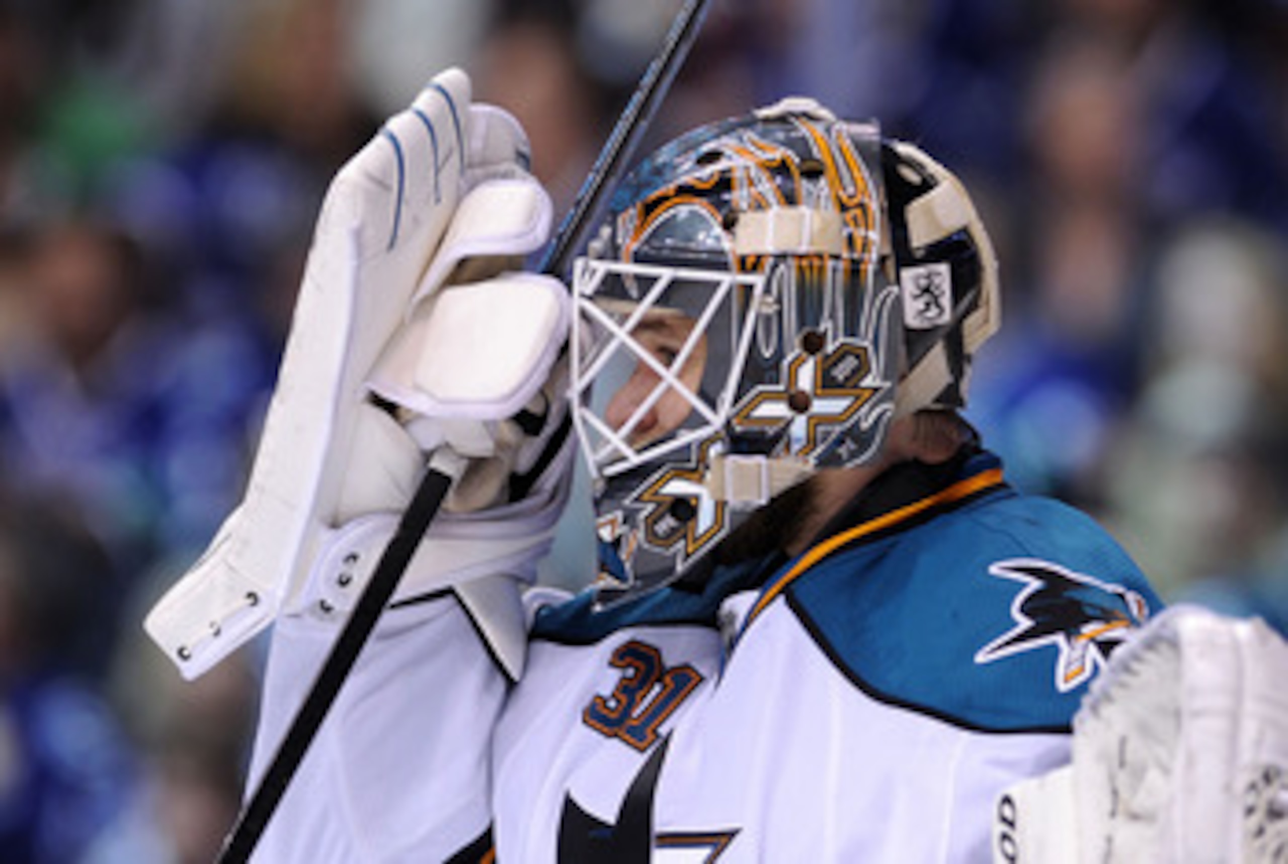 VANCOUVER, CANADA - MAY 15: Goaltender Antti Niemi #31 of the San Jose Sharks adjusts his mask during a break in play in Game One of the Western Conference Finals against the Vancouver Canucks during the 2011 Stanley Cup Playoffs at Rogers Arena on May 1 VANCOUVER, CANADA - MAY 15: Goaltender Antti Niemi #31 of the San Jose Sharks adjusts his mask during a break in play in Game One of the Western Conference Finals against the Vancouver Canucks during the 2011 Stanley Cup Playoffs at Rogers Arena on May 1