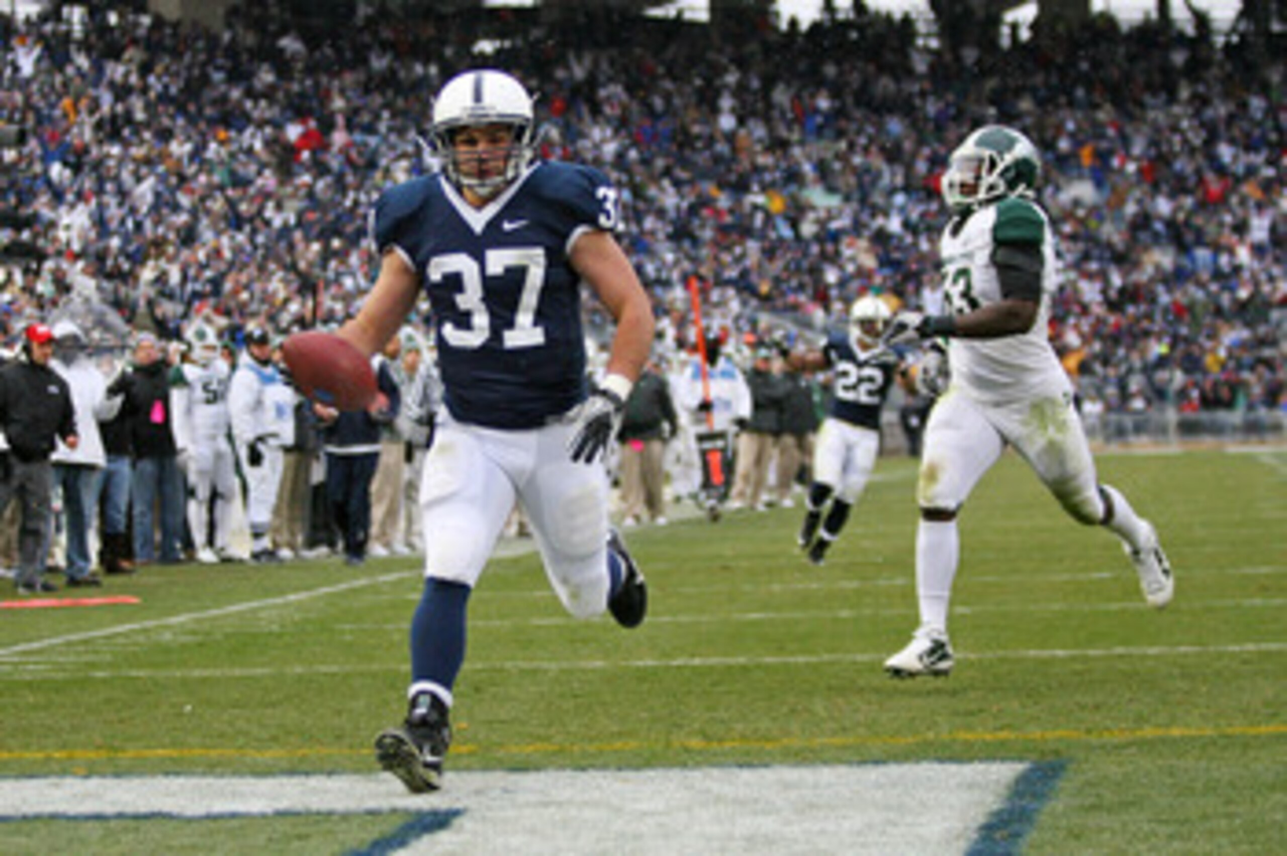 STATE COLLEGE, PA - NOVEMBER 27: Running back Joe Suhey #37 of the Penn State Nittany Lions scores a touchdown during a game against the Michigan State Spartans on November 27, 2010 at Beaver Stadium in State College, Pennsylvania. The Spartans won 28-22.