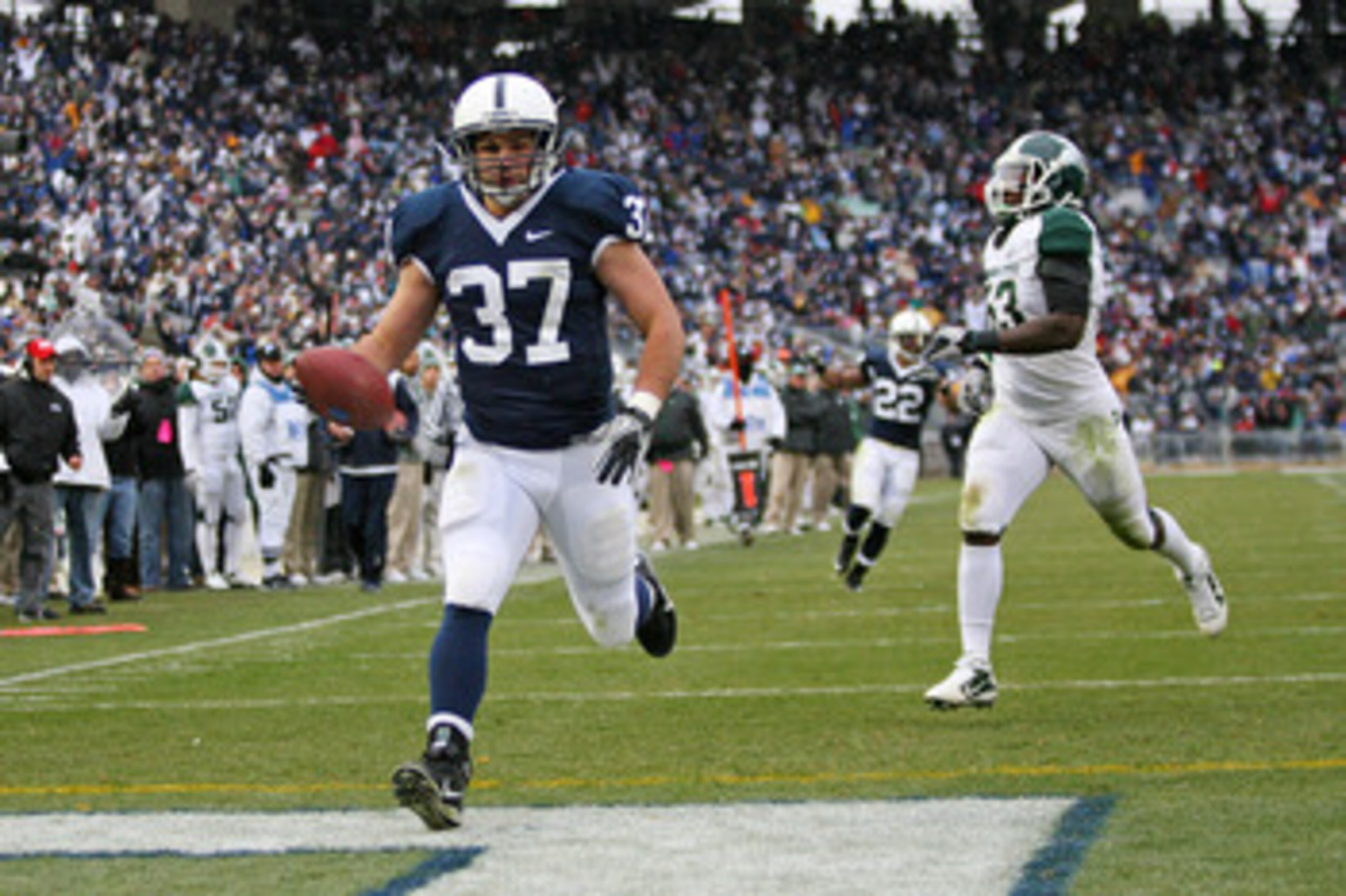STATE COLLEGE, PA - NOVEMBER 27: Running back Joe Suhey #37 of the Penn State Nittany Lions scores a touchdown during a game against the Michigan State Spartans on November 27, 2010 at Beaver Stadium in State College, Pennsylvania. The Spartans won 28-22.