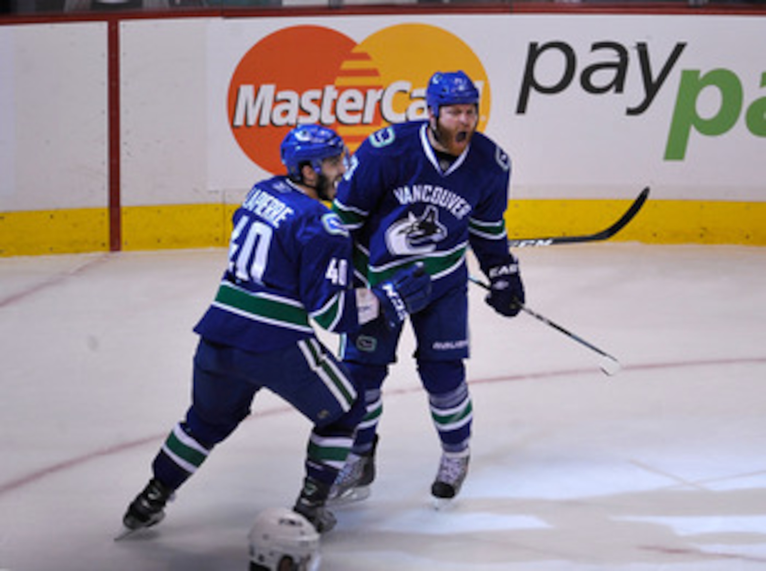 VANCOUVER, CANADA - MAY 18: Raffi Torres #13 of the Vancouver Canucks reacts after scoring a goal as teammate Maxim Lapierre #40 joins Torres to celebrate in Game Two of the Western Conference Finals against the San Jose Sharks during the 2011 Stanley Cu VANCOUVER, CANADA - MAY 18: Raffi Torres #13 of the Vancouver Canucks reacts after scoring a goal as teammate Maxim Lapierre #40 joins Torres to celebrate in Game Two of the Western Conference Finals against the San Jose Sharks during the 2011 Stanley Cu