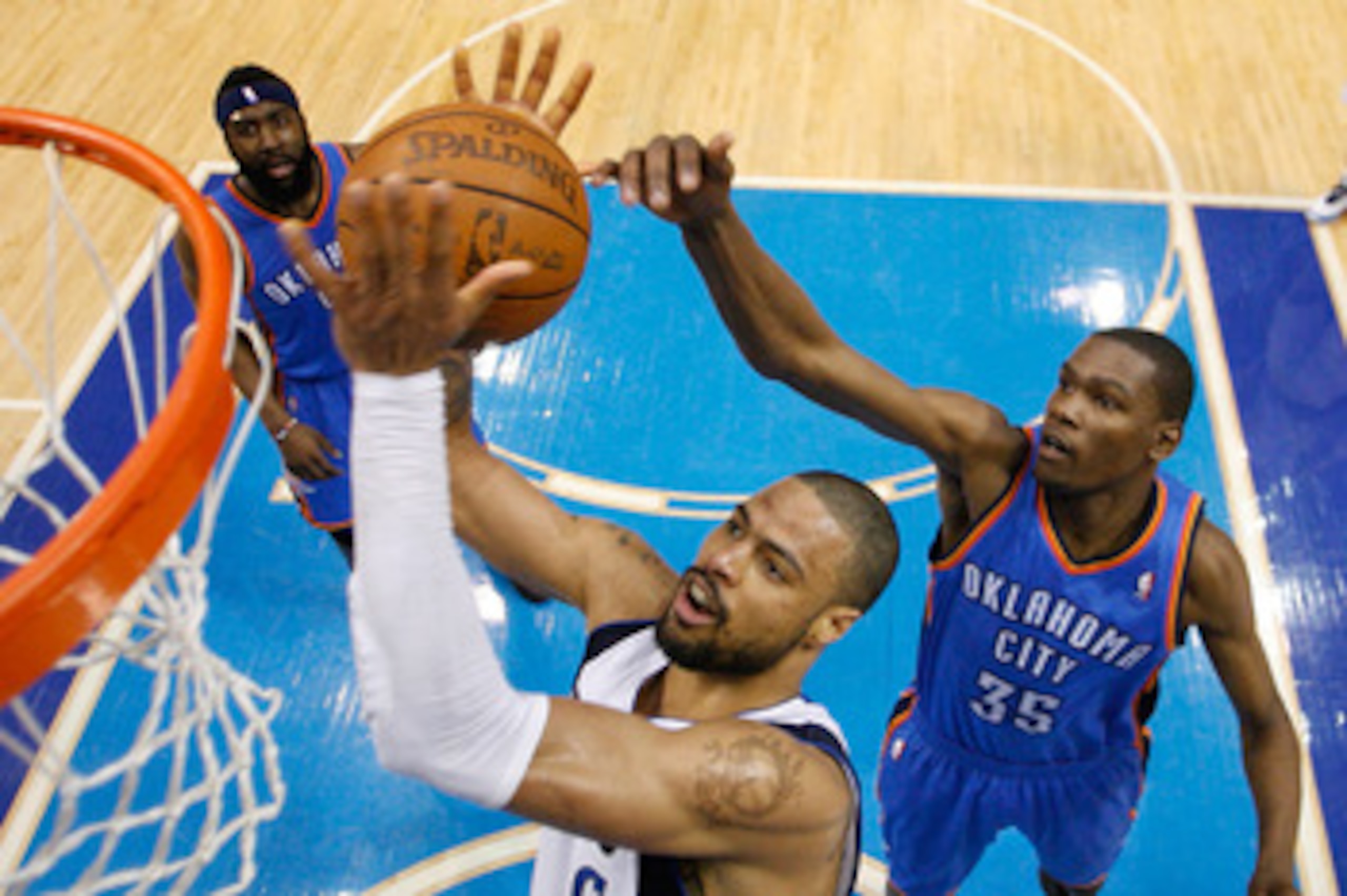 DALLAS, TX - MAY 19:  Tyson Chandler #6 of the Dallas Mavericks grabs the ball in front of Kevin Durant #35 of the Oklahoma City Thunder in the second half in Game Two of the Western Conference Finals during the 2011 NBA Playoffs at American Airlines Cent