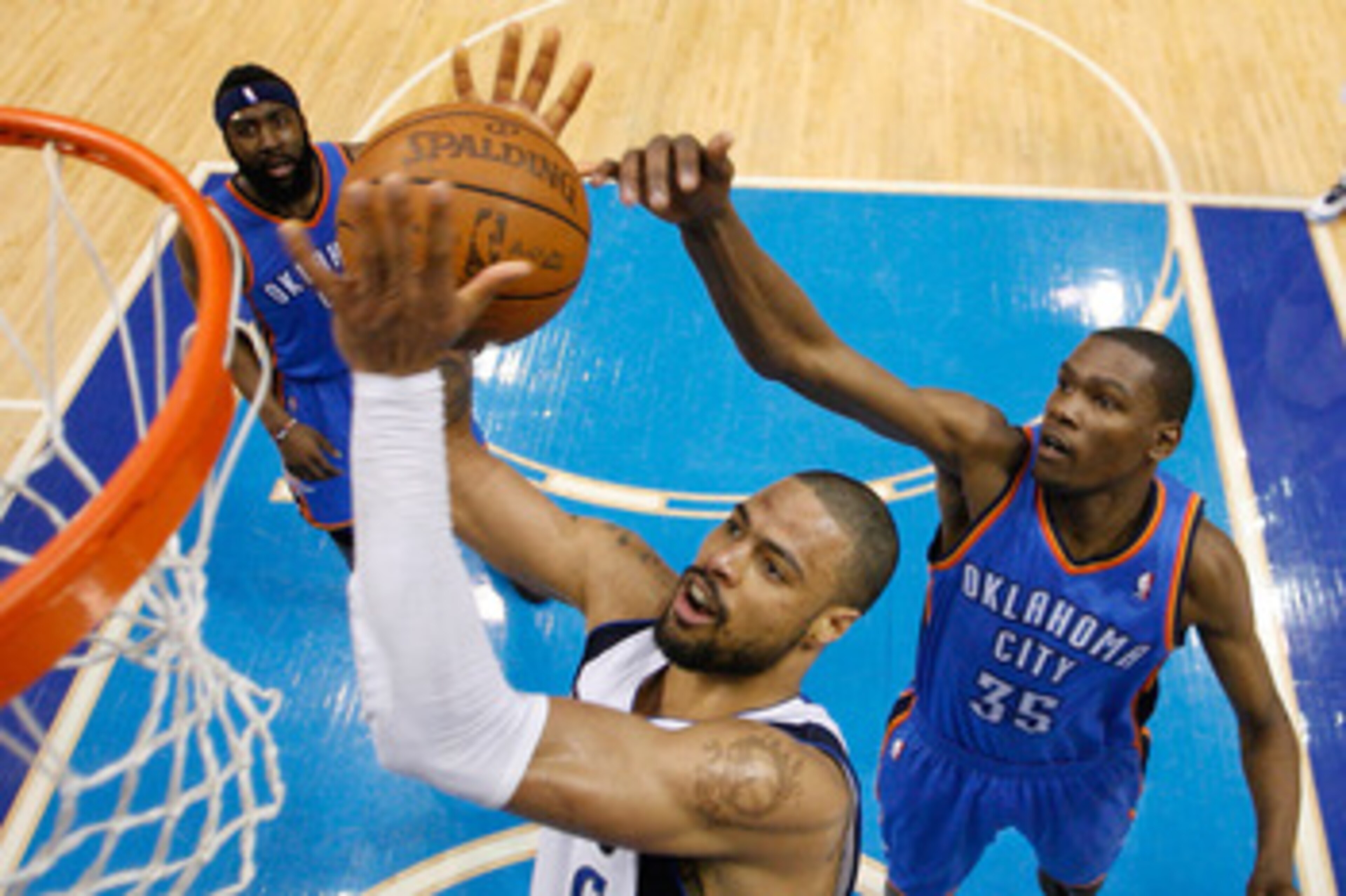 DALLAS, TX - MAY 19:  Tyson Chandler #6 of the Dallas Mavericks grabs the ball in front of Kevin Durant #35 of the Oklahoma City Thunder in the second half in Game Two of the Western Conference Finals during the 2011 NBA Playoffs at American Airlines Cent