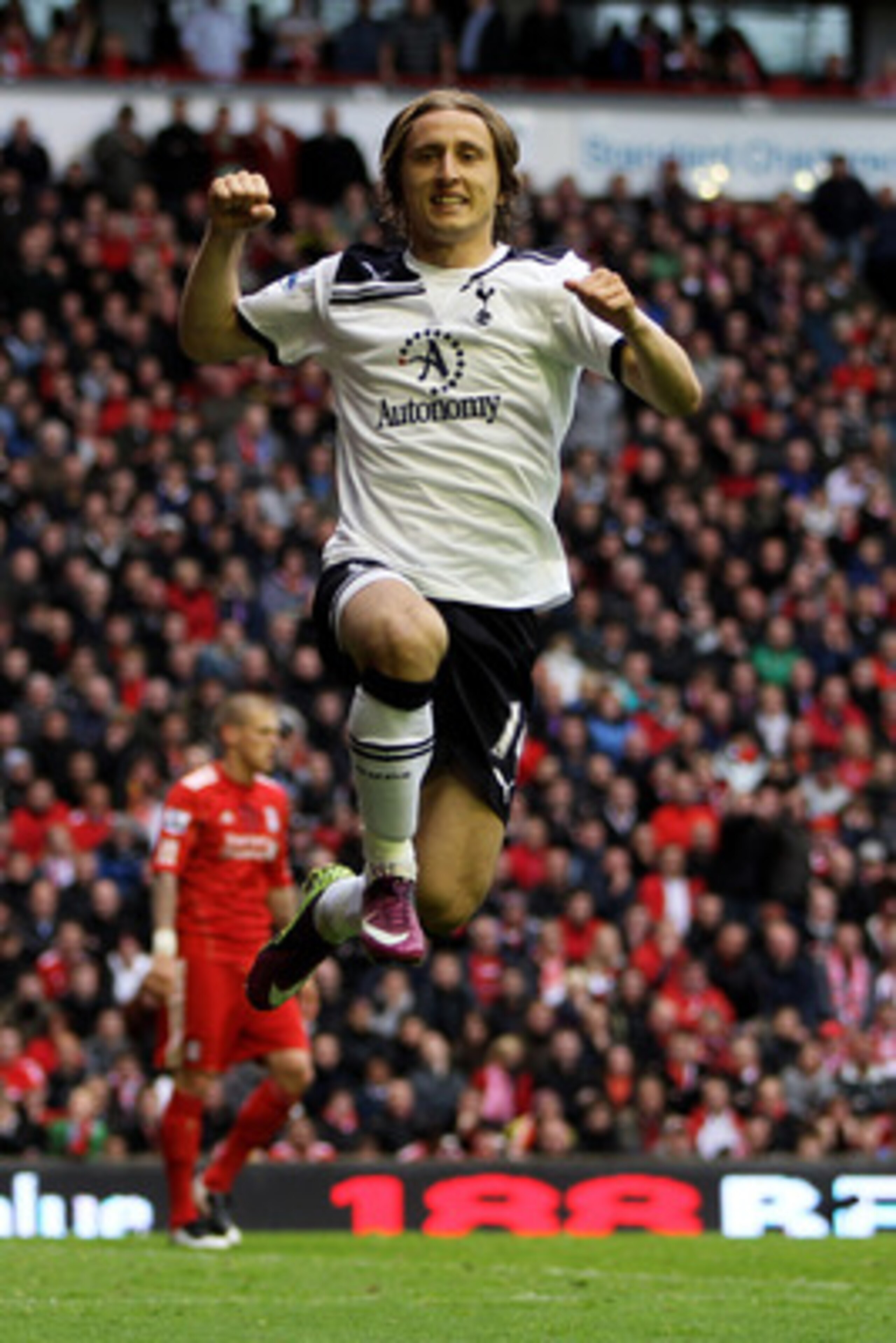 LIVERPOOL, ENGLAND - MAY 15:  Luka Modric of Spurs celebrates after scoring his team's second goal from the penalty spot during the Barclays Premier League match between Liverpool and Tottenham Hotspur at Anfield on May 15, 2011 in Liverpool, England.  (P