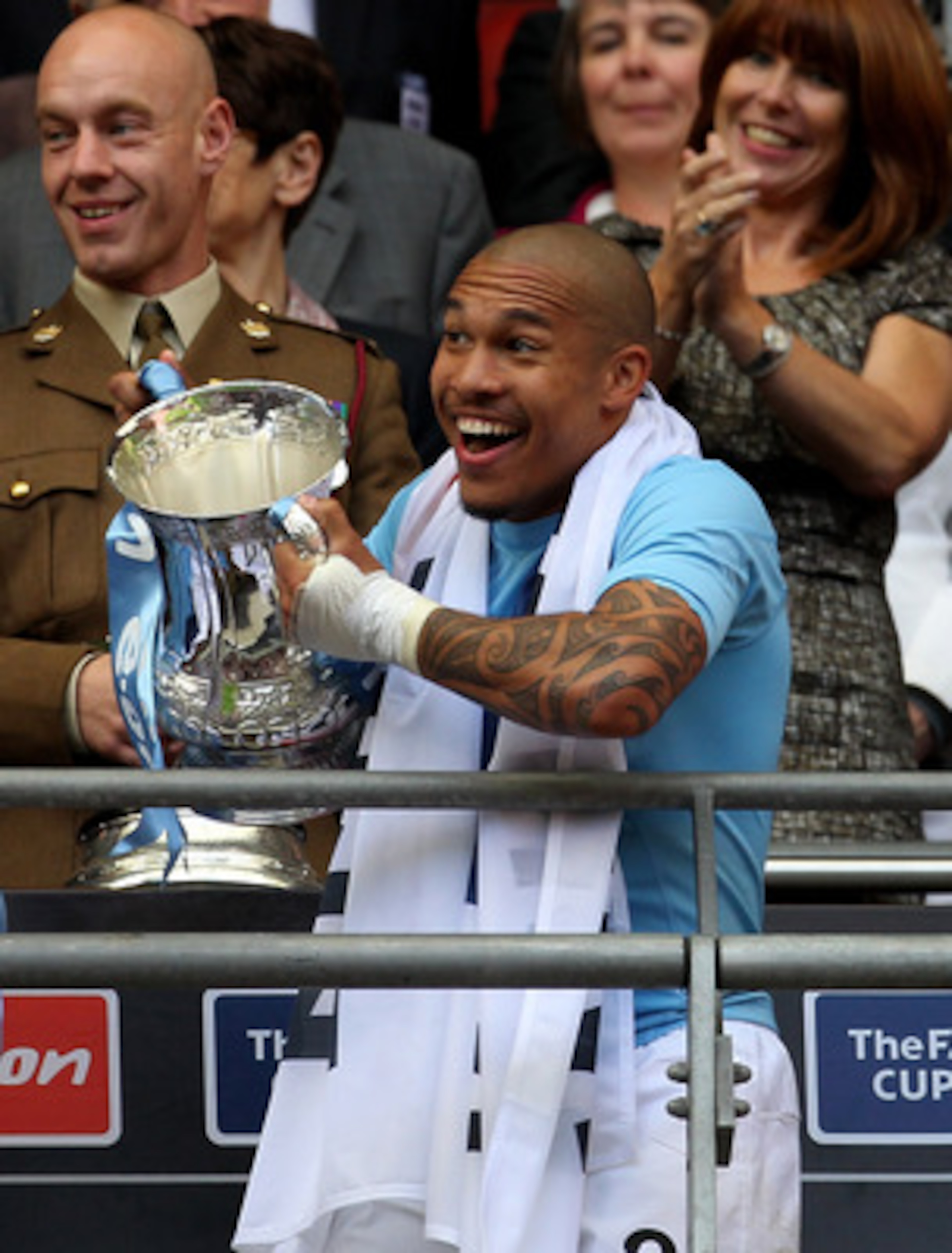LONDON, ENGLAND - MAY 14:  Nigel De Jong of Manchester City celebrates with the trophy after his side's victory during the FA Cup sponsored by E.ON Final match between Manchester City and Stoke City at Wembley Stadium on May 14, 2011 in London, England.  