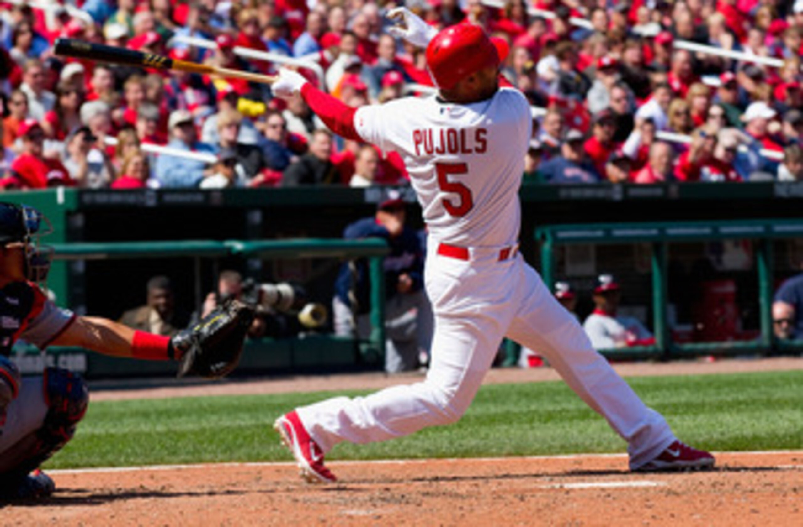 ST. LOUIS, MO - APRIL 21: Albert Pujols #5 of the St. Louis Cardinals hits a two-run home run against the Washington Nationals at Busch Stadium on April 21, 2011 in St. Louis, Missouri.  (Photo by Dilip Vishwanat/Getty Images)