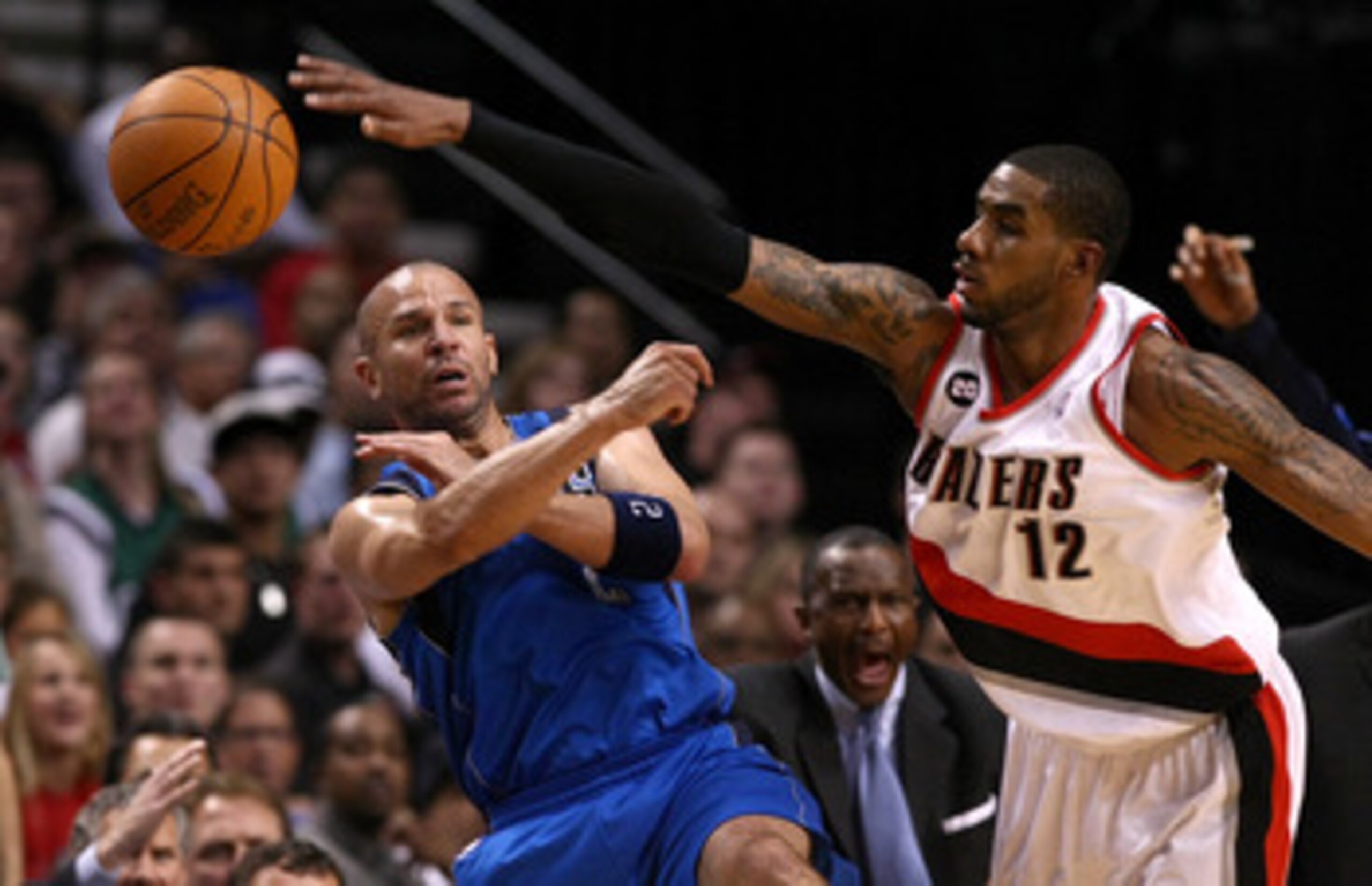 PORTLAND, OR - APRIL 23:  LaMarcus Aldridge #12 of the Portland Trail Blazers defends Jason Kidd #2 of the Dallas Mavericks in Game Four of the Western Conference Quarterfinals in the 2011 NBA Playoffs on April 23, 2011 at the Rose Garden in Portland, Ore