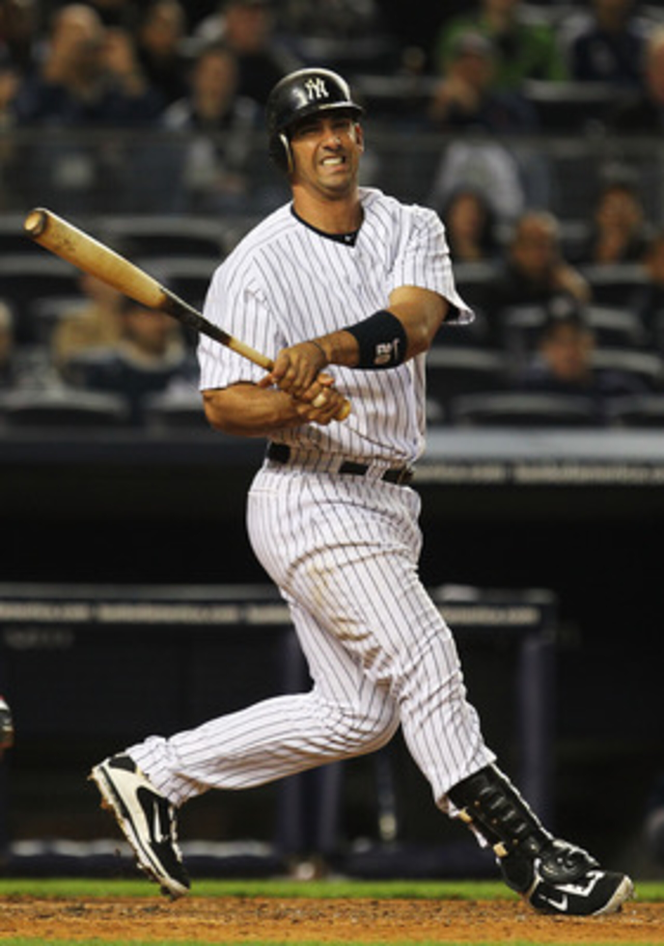 NEW YORK, NY - MAY 15:  Jorge Posada #20 of the New York Yankees reacts after missing a pitch against the Boston Red Sox during their game on May 15, 2011 at Yankee Stadium in the Bronx borough of New York City.  (Photo by Al Bello/Getty Images)