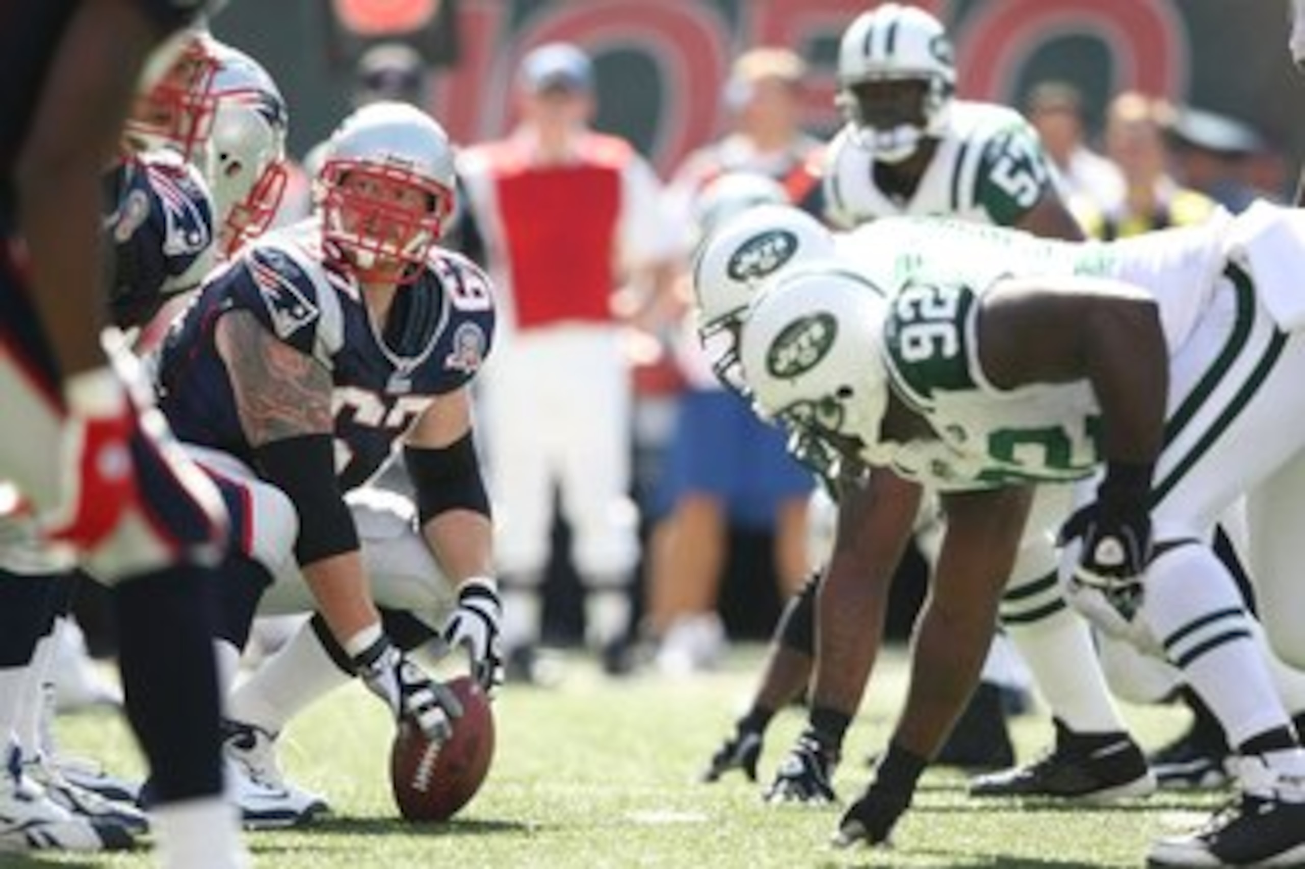 EAST RUTHERFORD, NJ - SEPTEMBER 20:  Dan Koppen #67 of the New England Patriots prepares to snap against the New York Jets at Giants Stadium on September 20, 2009 in East Rutherford, New Jersey.  (Photo by Nick Laham/Getty Images)