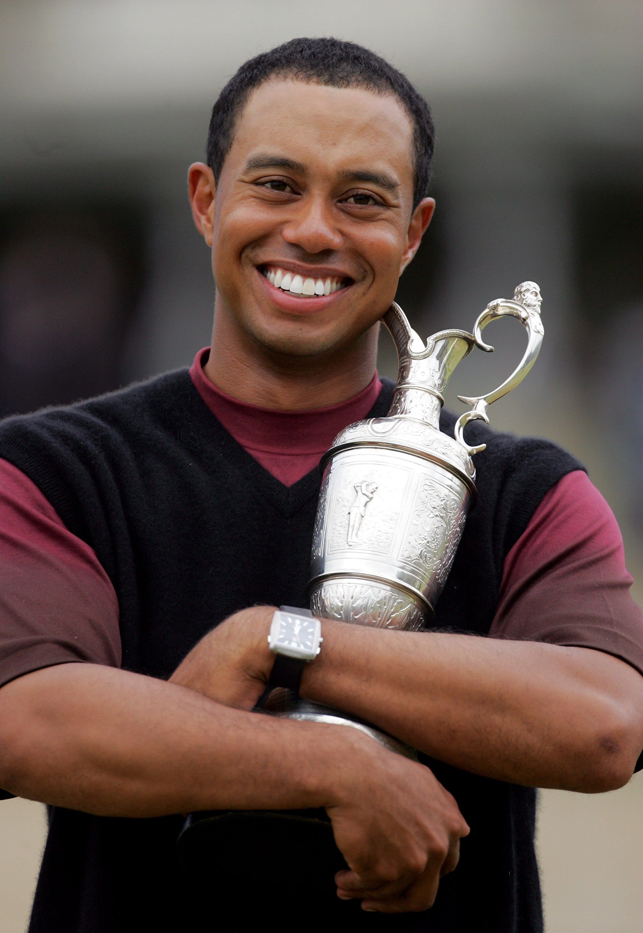ST. ANDREWS, UNITED KINGDOM - JULY 17:  Tiger Woods of the USA hugs the Claret Jug after securing a five shot victory at the 134th Open Championship at Old Course, St Andrews Golf Links, July 17, 2005 in St Andrews, Scotland.  (Photo by Jamie Squire/Getty