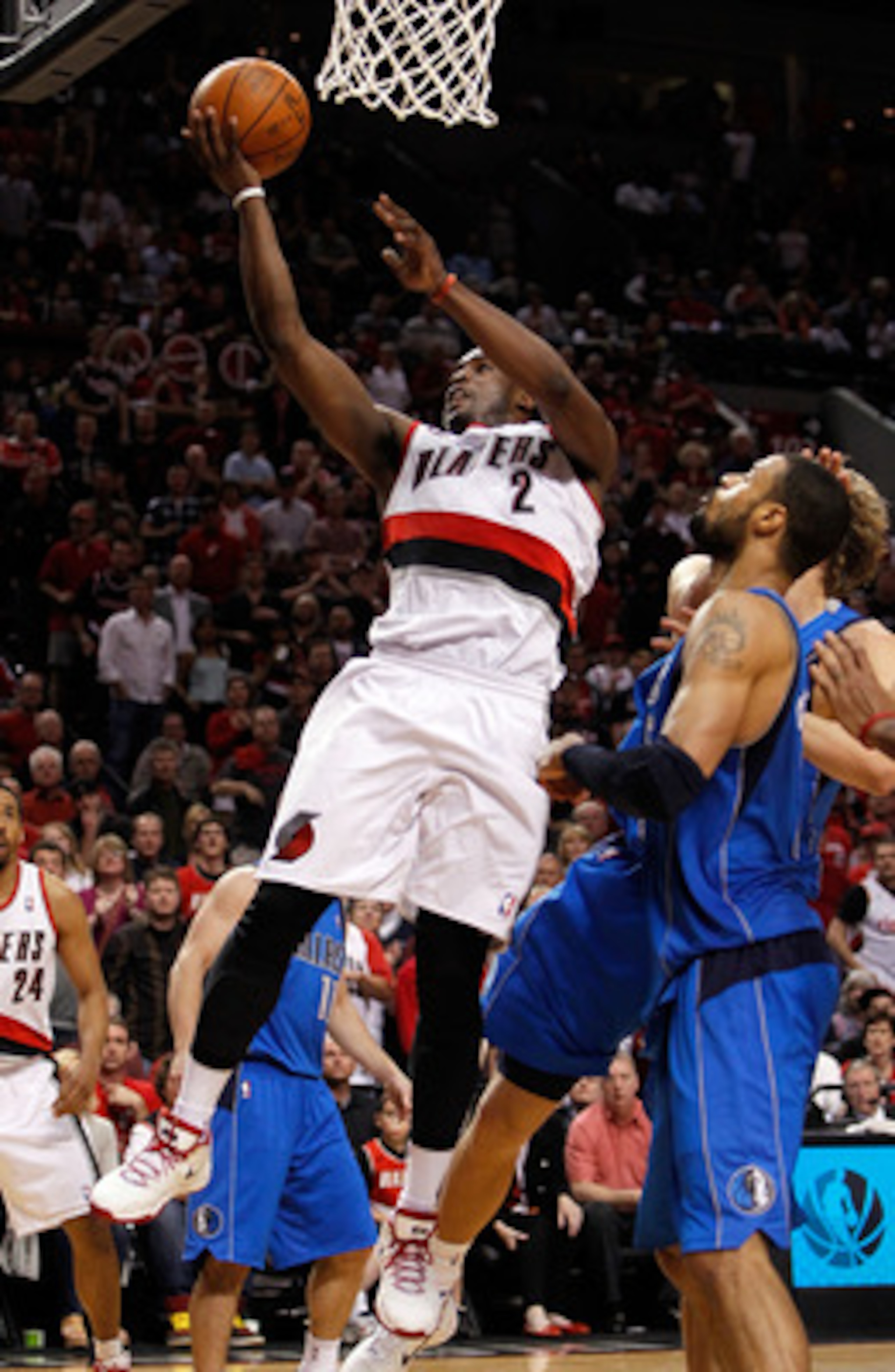 PORTLAND, OR - APRIL 23:  Wesley Matthews #2 of the Portland Trail Blazers lays up the ball against the Dallas Mavericks in Game Four of the Western Conference Quarterfinals in the 2011 NBA Playoffs on April 23, 2011 at the Rose Garden in Portland, Oregon